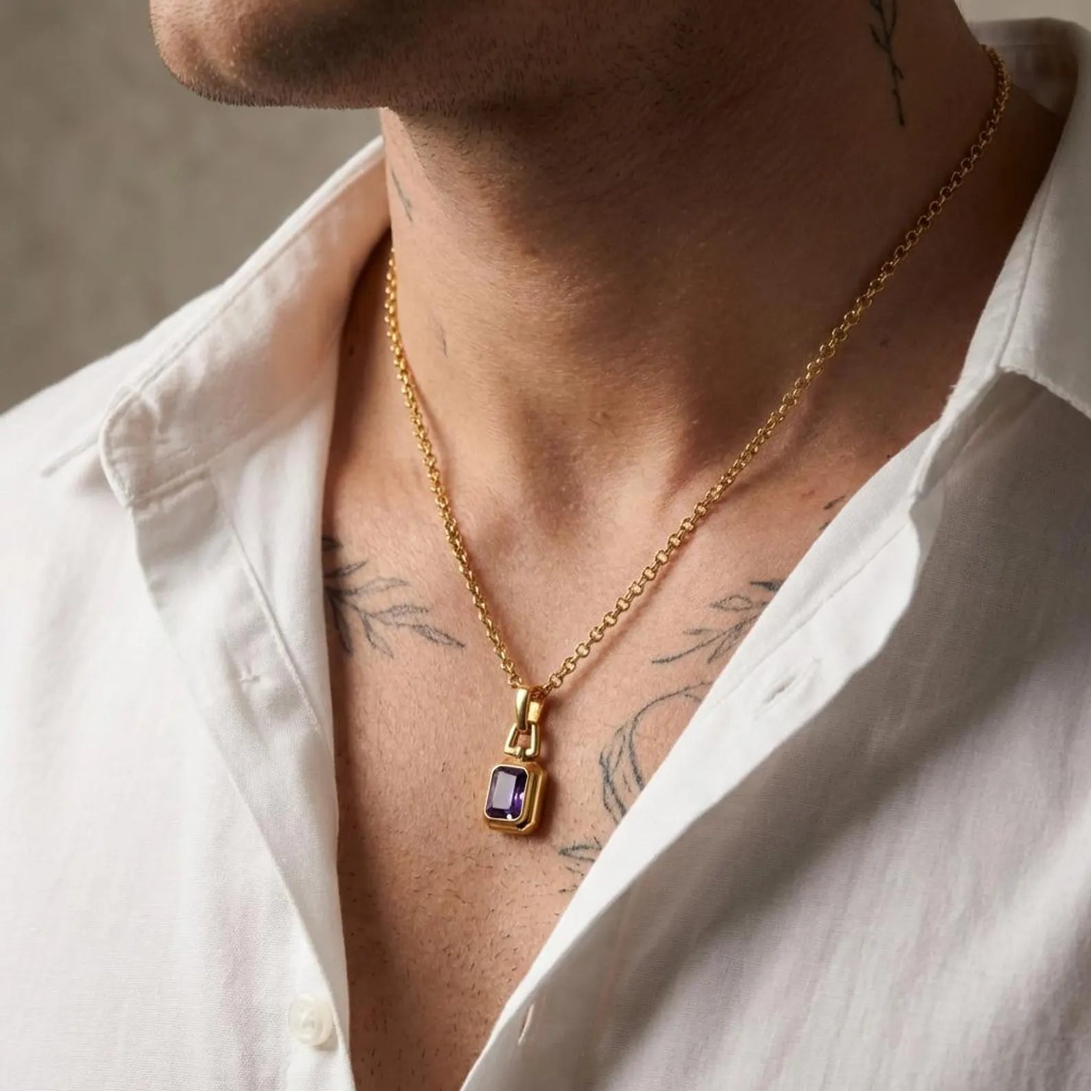 Unisex luxury birthstone necklace featuring a deep purple amethyst gemstone pendant, crafted from hypoallergenic 925 sterling silver with an elegant 18K gold plated finish