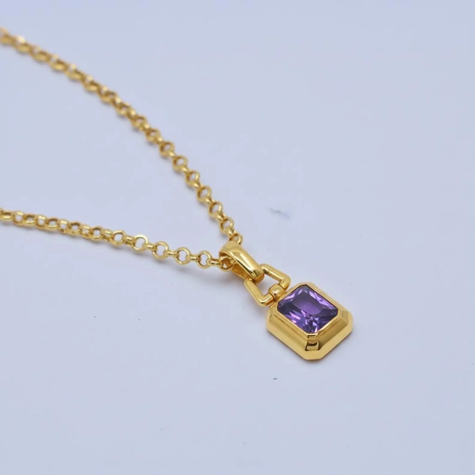 Premium handcrafted amethyst gemstone necklace with solid sterling silver base and gold plated finish, photographed to highlight pendant thickness, gemstone depth, and refined polish