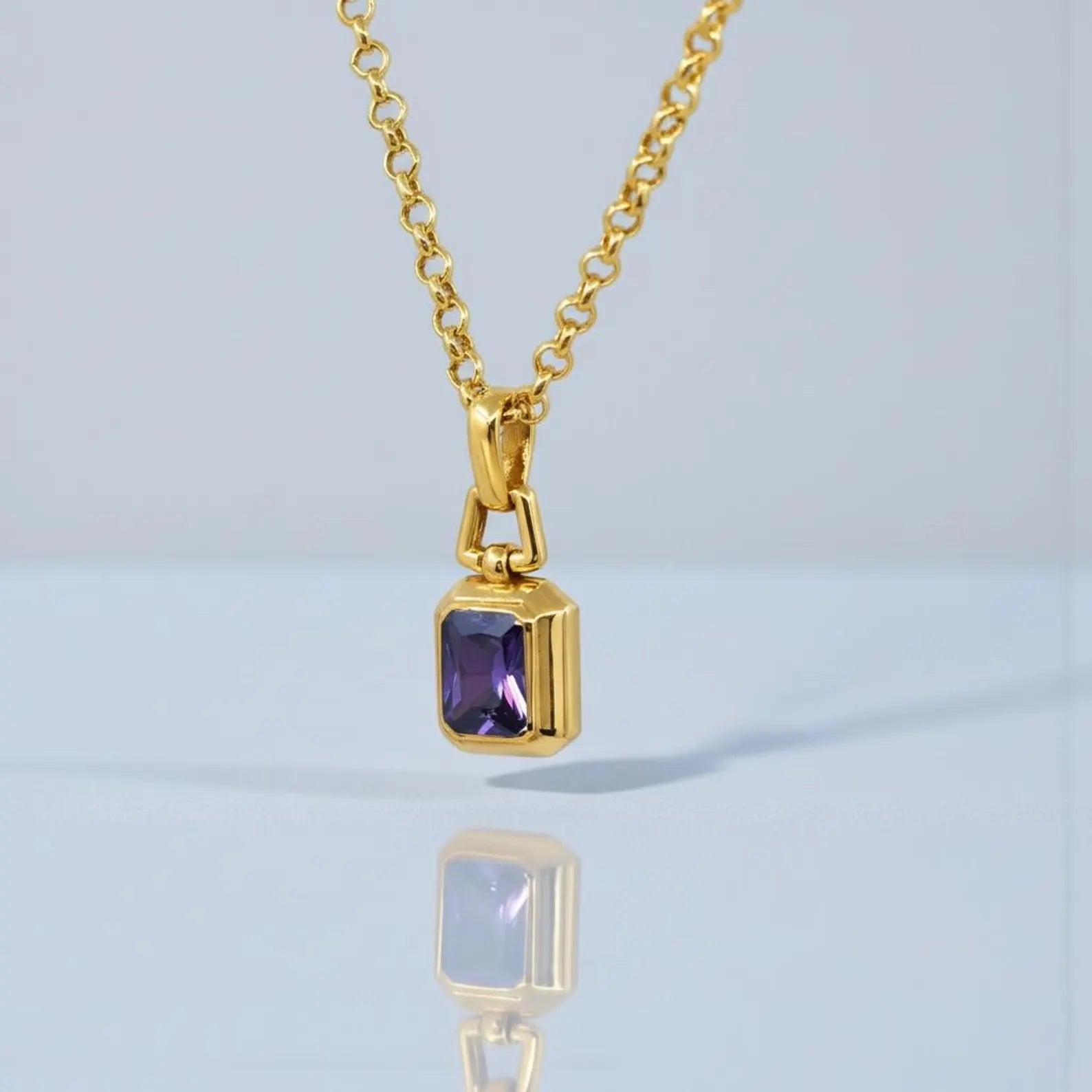 Elegant minimalist amethyst pendant necklace made of 925 sterling silver with 18K gold plated finish, showcasing a bold yet refined unisex jewelry design suitable for everyday wear or special occasions