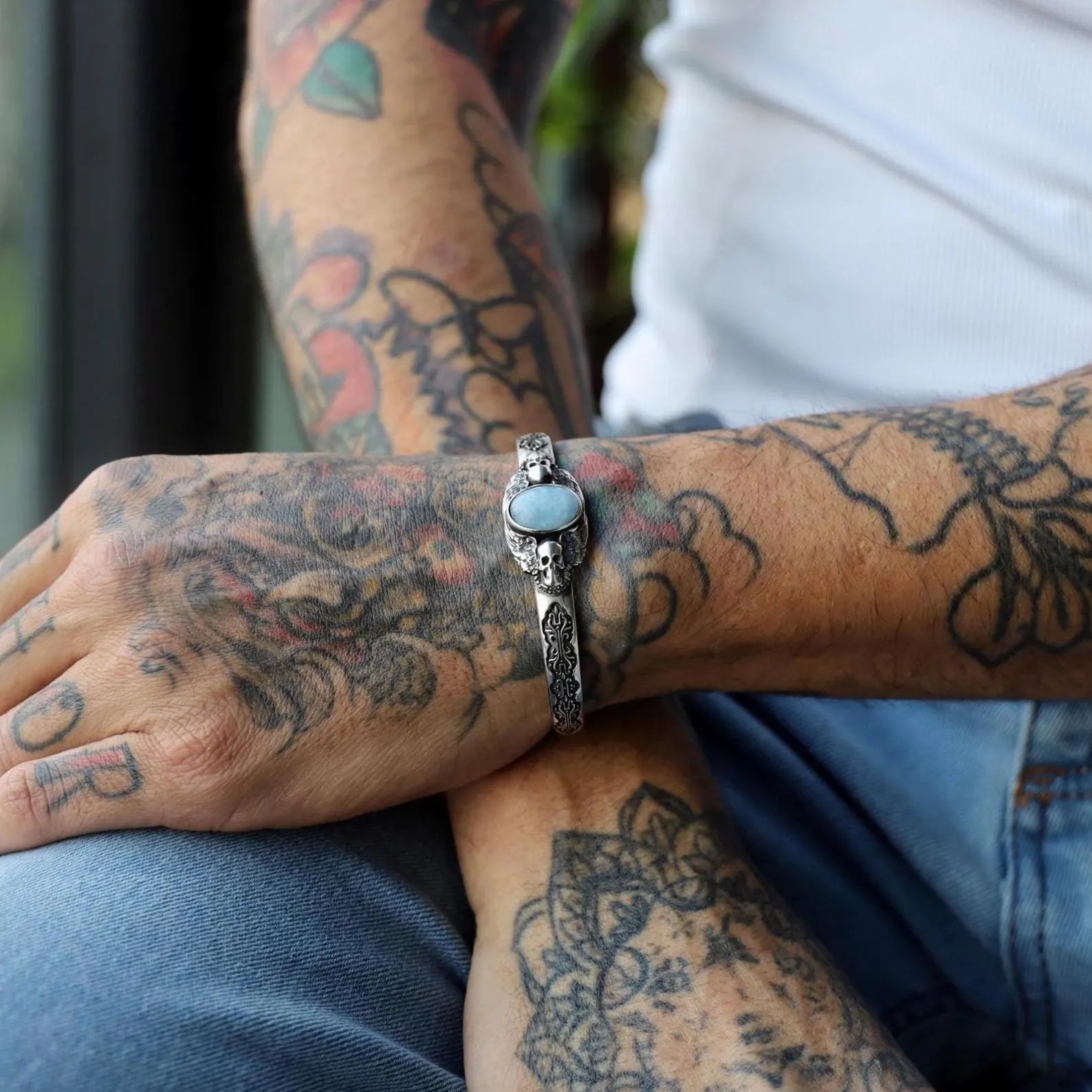 Detailed shot of the bracelet’s impressive 35-gram weight, 160mm adjustable diameter, 20mm height, and 6mm thickness, emphasizing the solid, substantial build of this gothic statement piece. Crafted from high-quality sterling silver and finished with a skull and aquamarine design, this bracelet offers durability and bold masculine elegance for men who appreciate spiritual and alternative jewelry