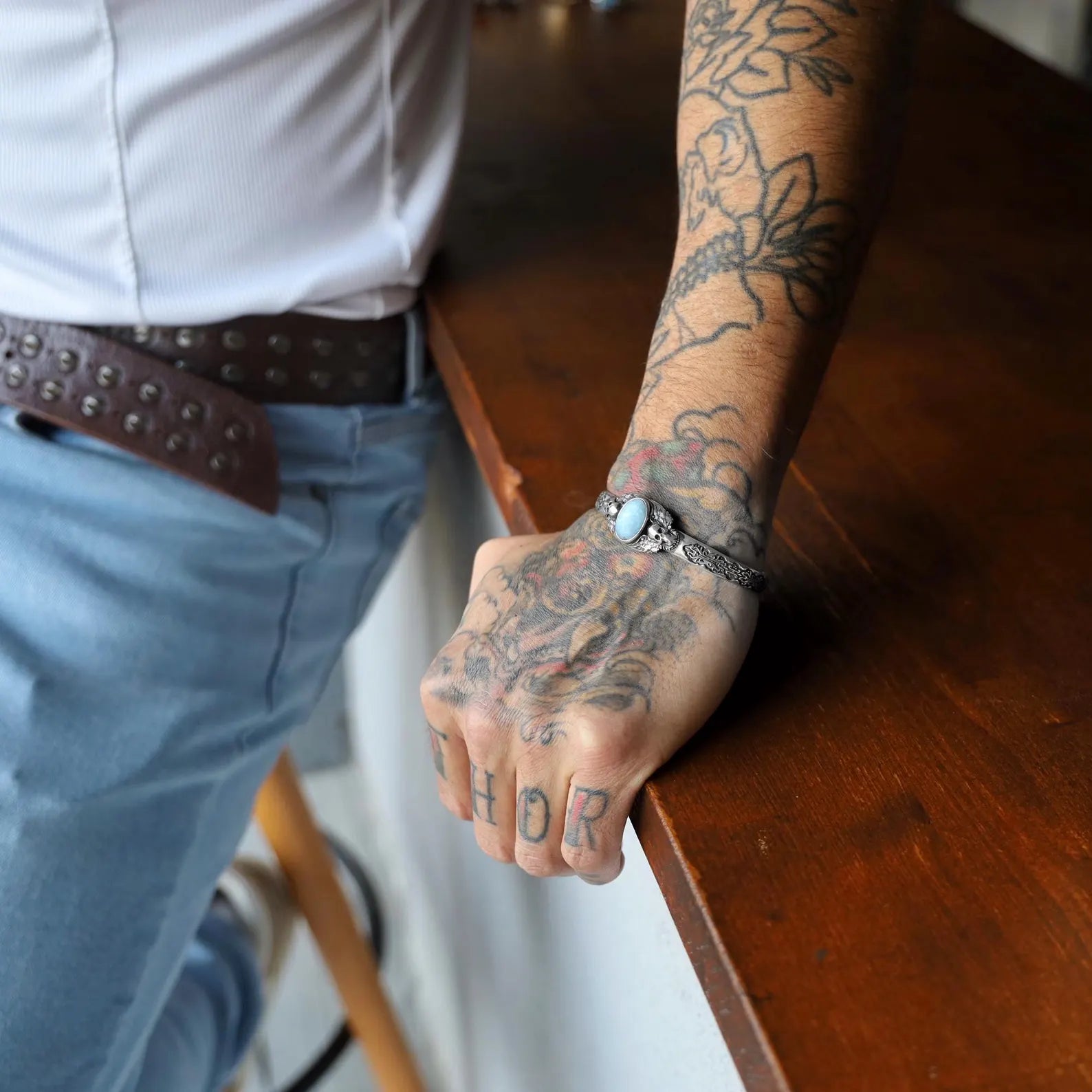 Styled on the wrist, this stunning silver aquamarine bracelet with a gothic skull charm adds a touch of dark elegance and spiritual power to any outfit. Handcrafted for men who love alternative fashion, biker style, and spiritual jewelry, this bracelet is both a bold fashion statement and a meaningful accessory that resonates with your inner warrior and spiritual seeker.