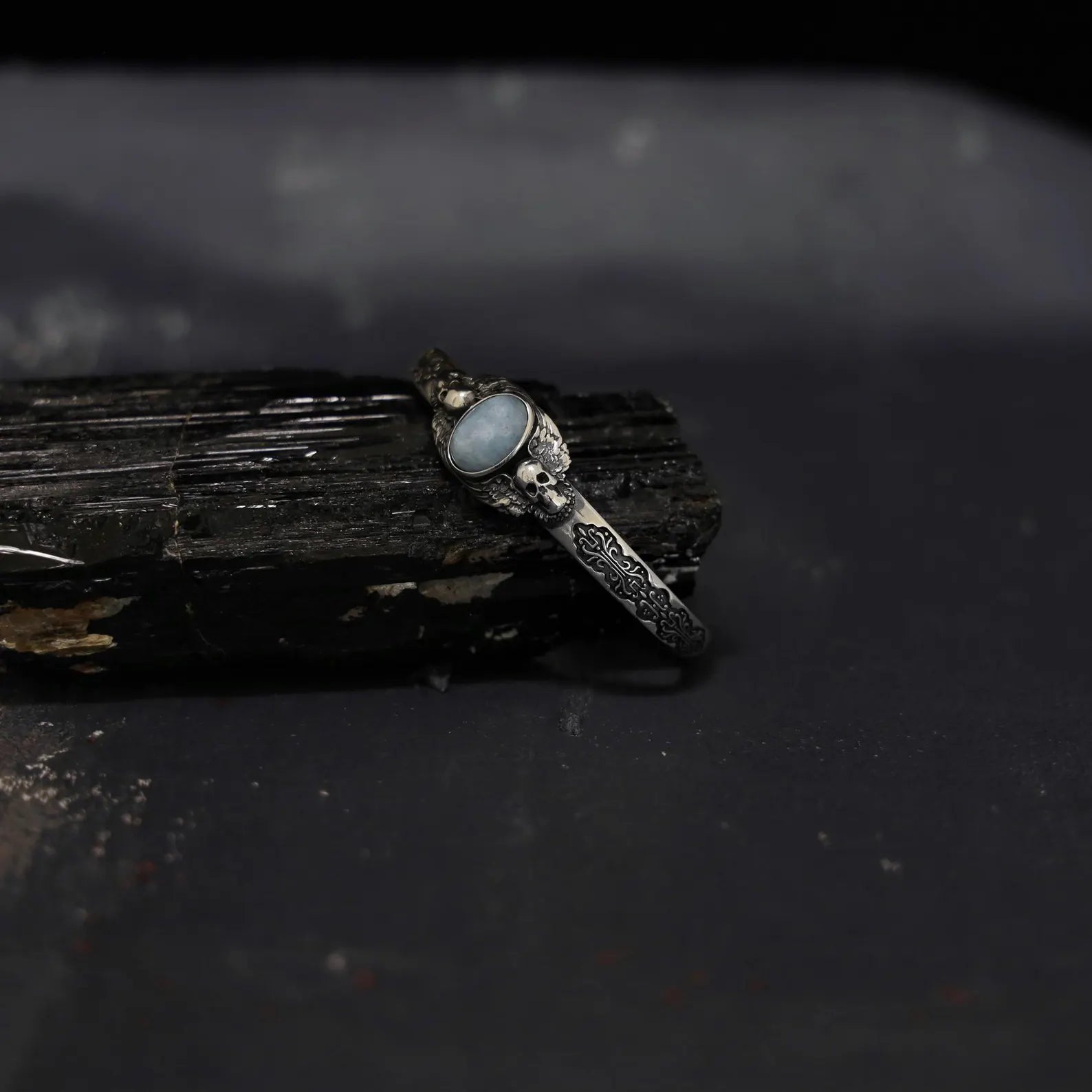 Detailed view of the bracelet’s inner band, featuring an engraving option for names, dates, or special symbols. Create a one-of-a-kind piece that reflects his personality and style. This personalized engraved gothic bracelet with aquamarine stone is the perfect heirloom for men who love alternative fashion and spiritual symbolism, adding an extra layer of sentiment and story to their jewelry collection.