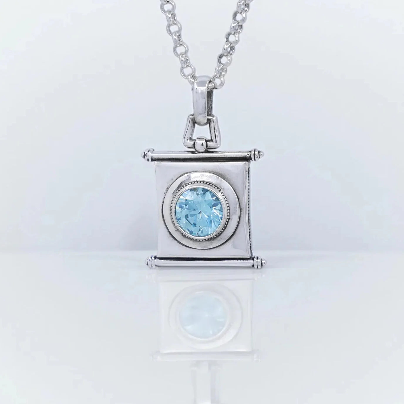 Handmade sterling silver pendant necklace featuring a sparkling aquamarine gemstone in a vintage-inspired square design. This March birthstone jewelry piece symbolizes clarity, courage, and harmony. Perfect as a meaningful gift for her on birthdays, anniversaries, or holidays. Elegant artisan craftsmanship makes this aquamarine necklace a timeless treasure for everyday wear.