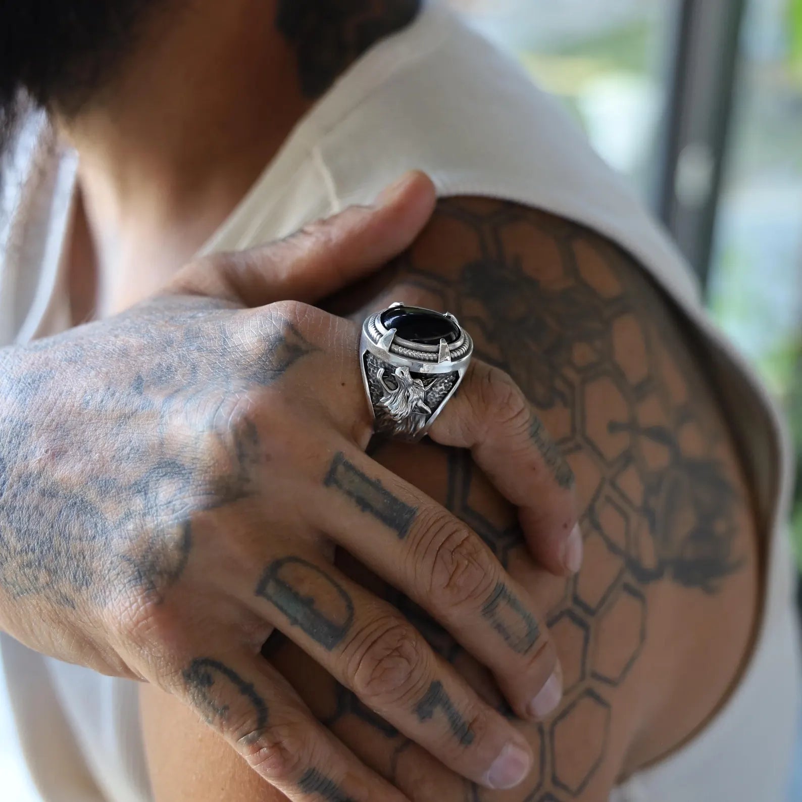 A bold and symbolic men's ring made from solid 925K sterling silver, adorned with a high-quality black onyx stone and fierce wolf carvings. The masterful craftsmanship evokes Norse mythology and tribal spirit, making this ring ideal for men who resonate with wild freedom, ancestral connection, and spiritual power. A true piece of wearable art that speaks volumes.