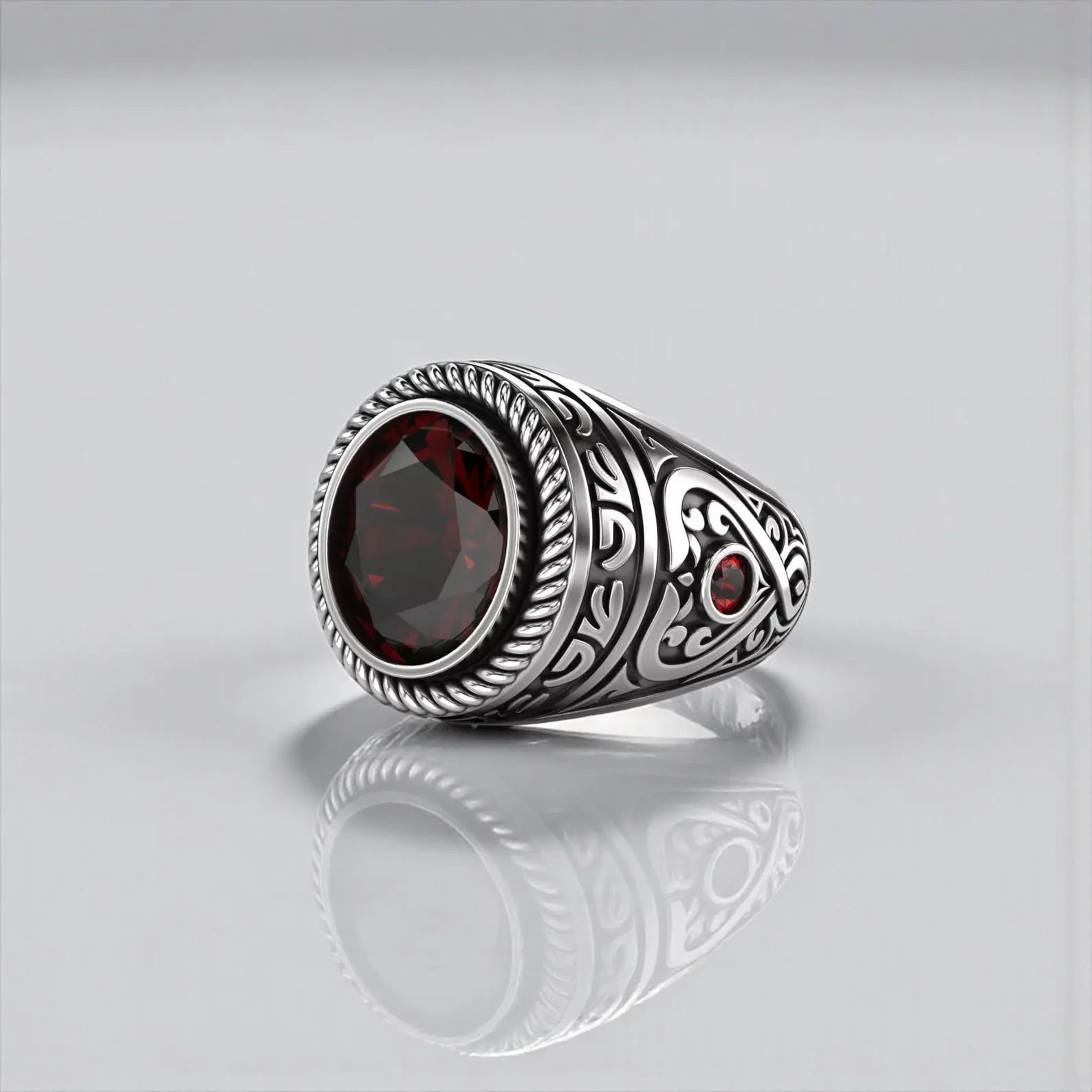 Handcrafted custom garnet ring for men made from solid 925 sterling silver, featuring a natural deep red oval garnet stone set in a bold gothic signet ring design with vintage character