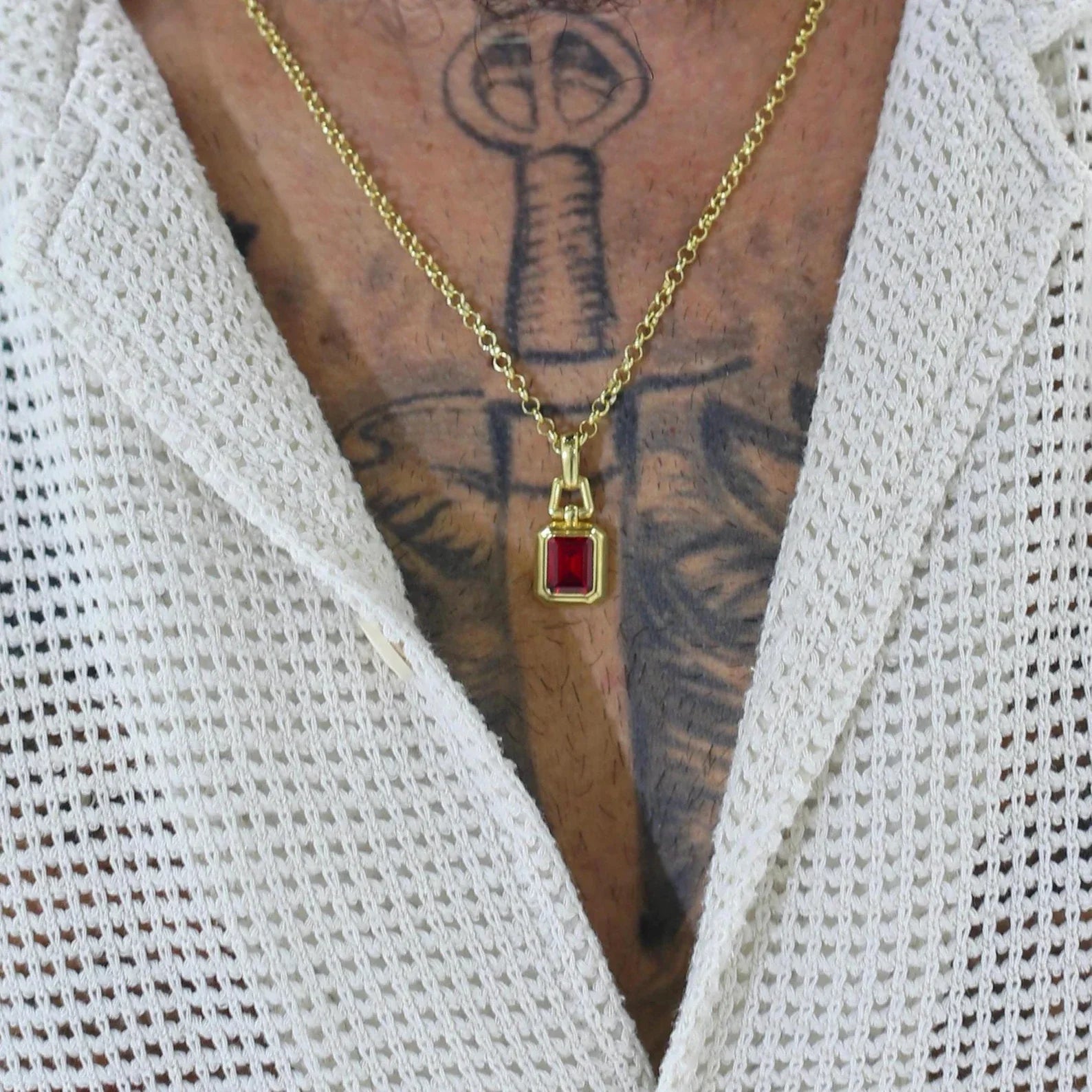 Handcrafted gold plated sterling silver necklace featuring a vivid lab-created ruby gemstone in an emerald cut setting. Accented by rich green emerald tones and a polished gold finish, this pendant exudes luxury and vintage elegance. A striking unisex accessory ideal for birthdays, anniversaries, or as a graduation gift. A top-rated Etsy necklace for men and women who appreciate ethnic and statement jewelry.