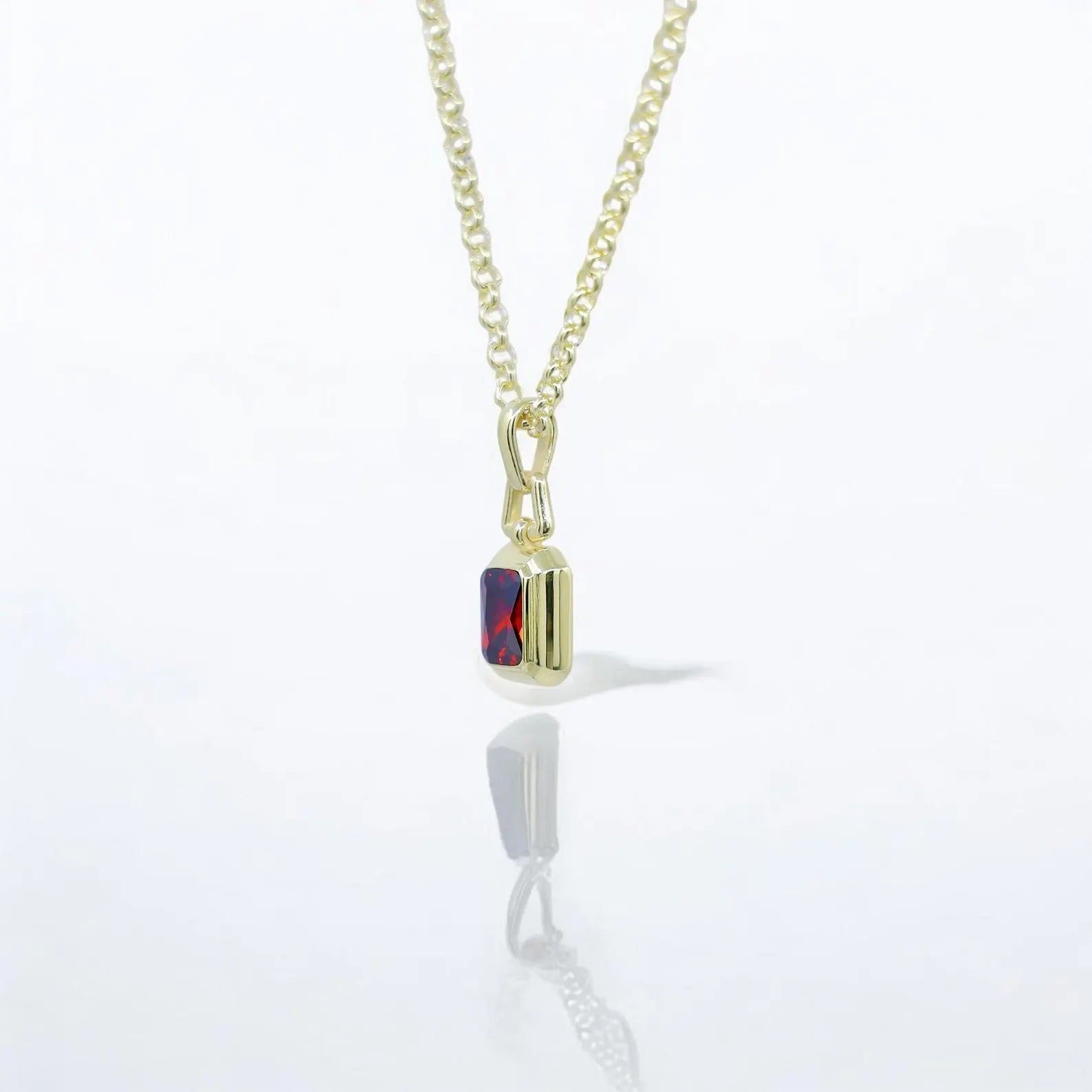 Handcrafted ruby pendant necklace in gold plated silver with a vibrant emerald-inspired hue. This gemstone jewelry piece is designed for everyday elegance and ideal for those who appreciate refined fashion with a personalized touch.