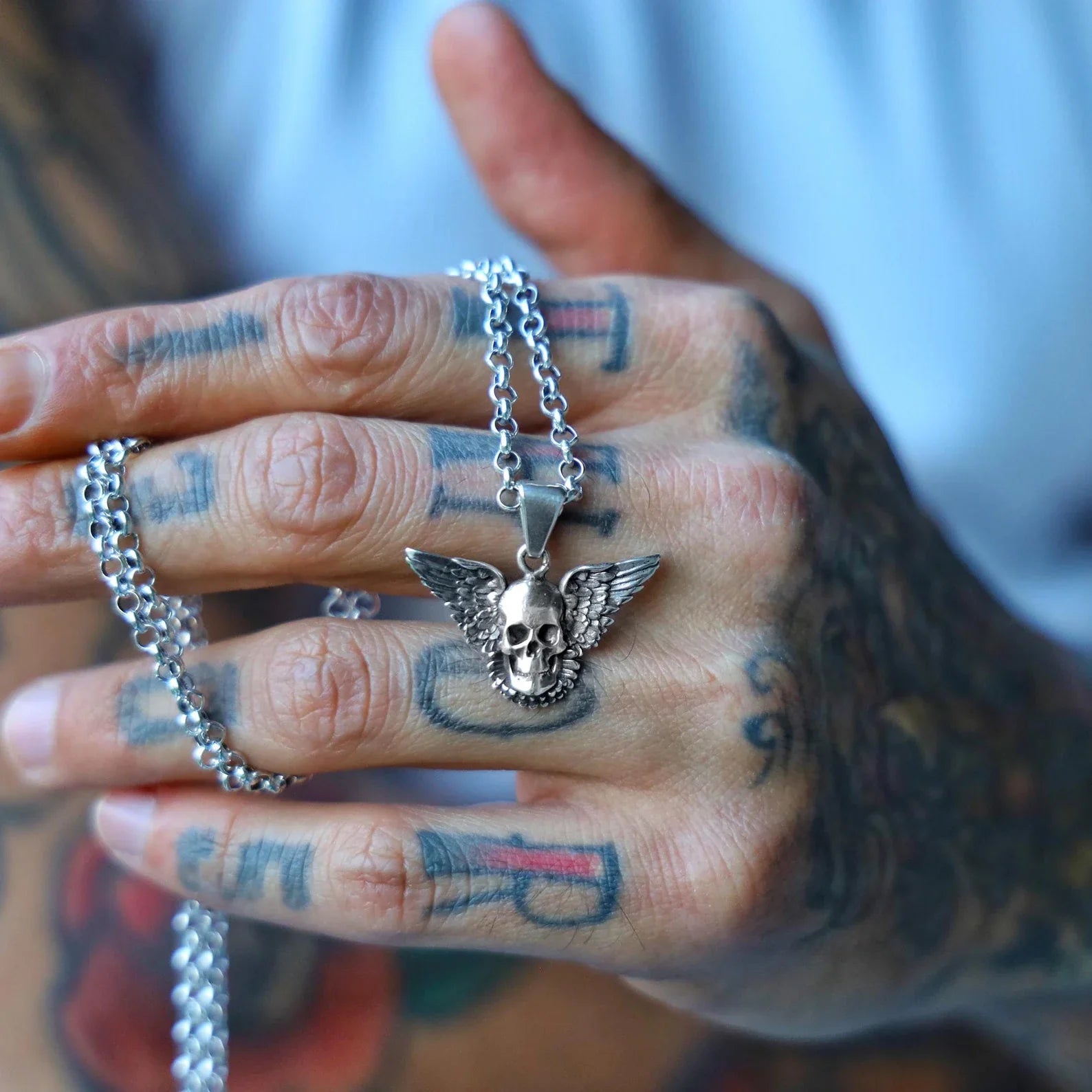 Make a fearless statement with this sterling silver skull wings necklace pendant designed for lovers of dark fashion and mystic energy. The handcrafted skull sits at the heart of a pair of sweeping wings, representing ascension, power, and individuality. A piece like this resonates with those who embrace non-conformity and find beauty in the mysterious. With a vintage gothic finish and heavy detailing, it’s not just jewelry—it’s wearable art that reflects personality, energy, and rebellion.