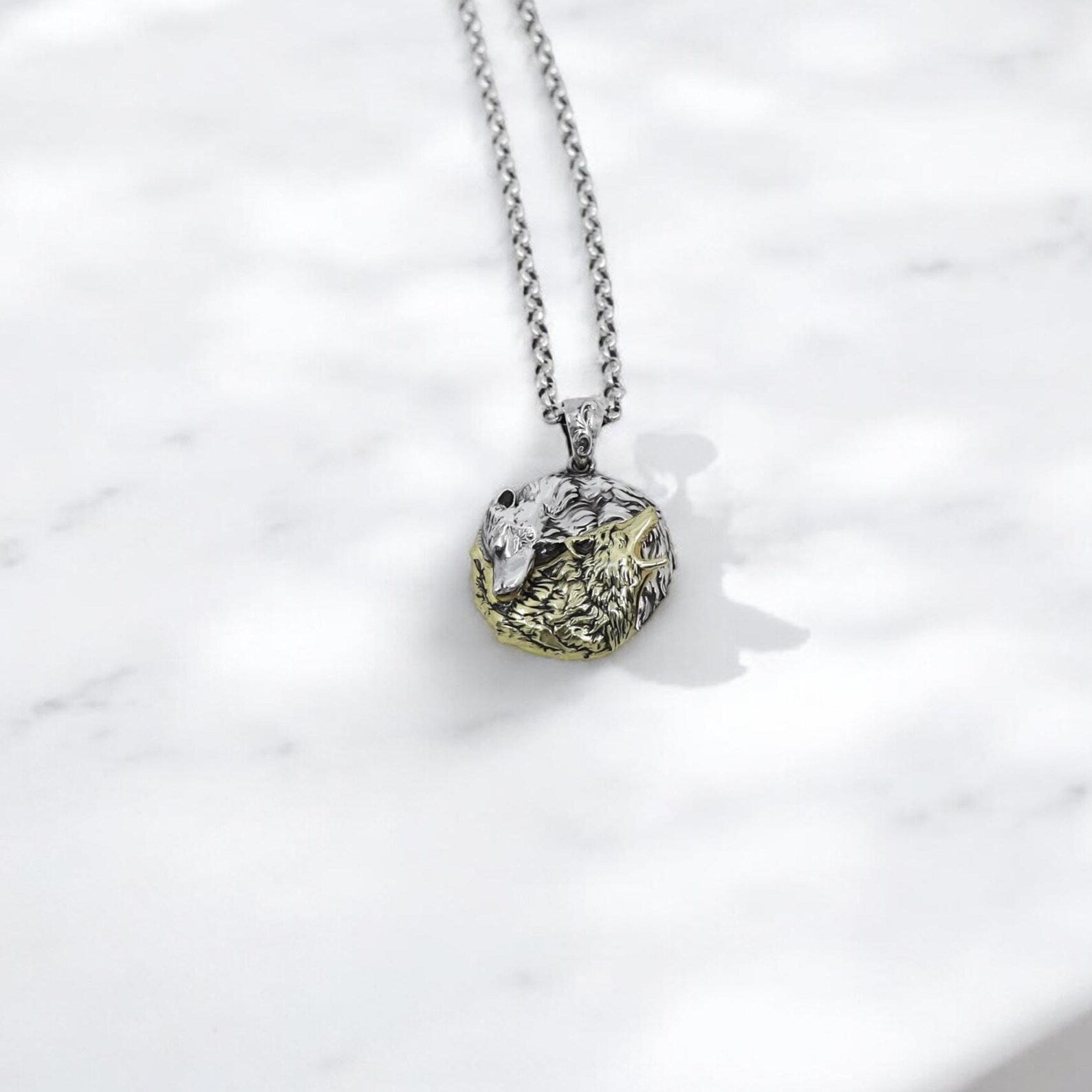 Elegant wolf-themed Yin Yang necklace in sterling silver and 14k gold plating, handcrafted with intricate detail. A stunning unisex jewelry piece that appeals to both masculine and feminine energies, ideal for women who value symbolism, spiritual balance, and the mystique of the wolf. Great for self-expression and as a spiritual gift.