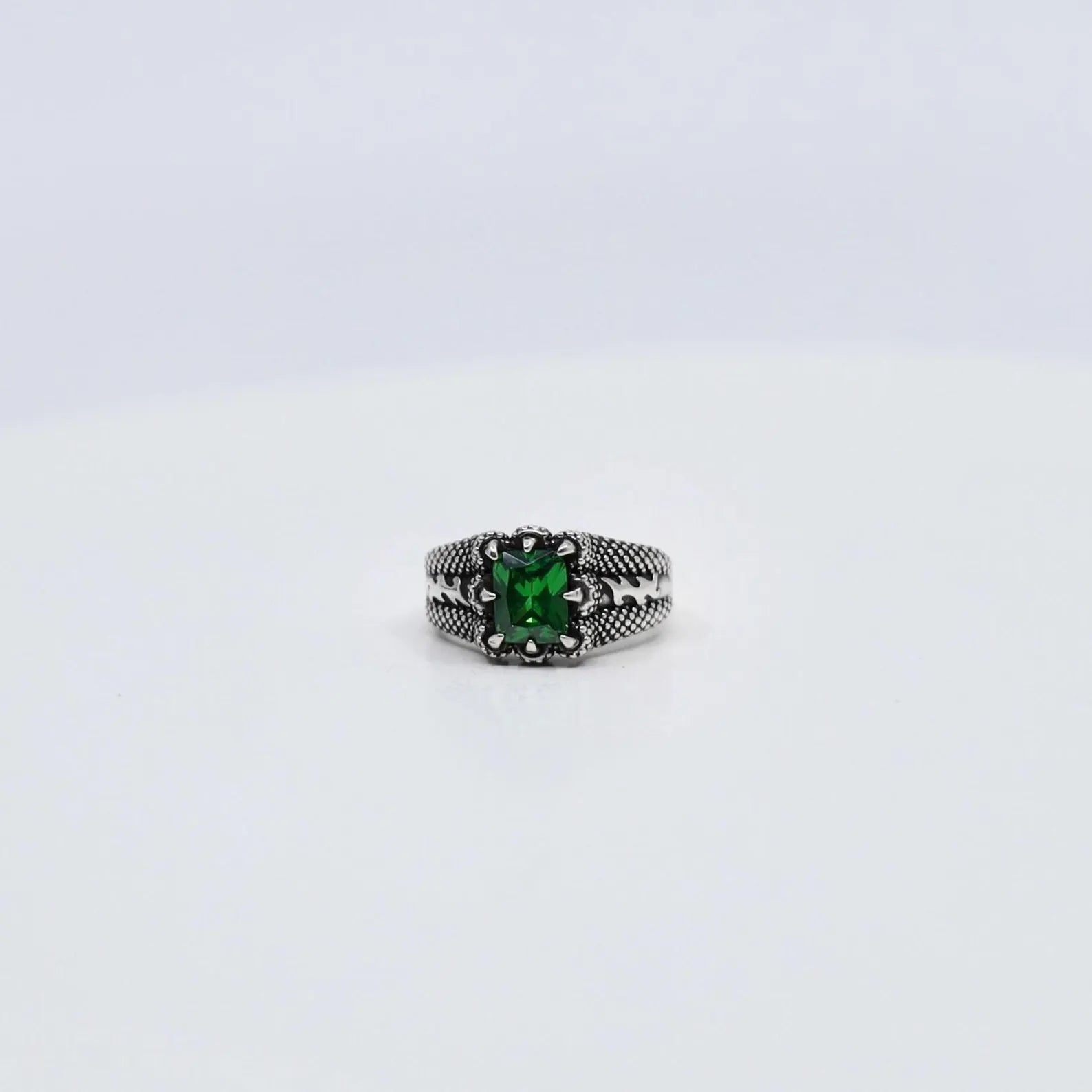 This sterling silver emerald cut zircon stone ring blends modern minimalist style with timeless elegance. The rich green hue of the gemstone stands out beautifully against the polished silver band, creating a refined statement piece that’s perfect for both men and women who love luxurious, handcrafted jewelry with a hint of color and classic charm.