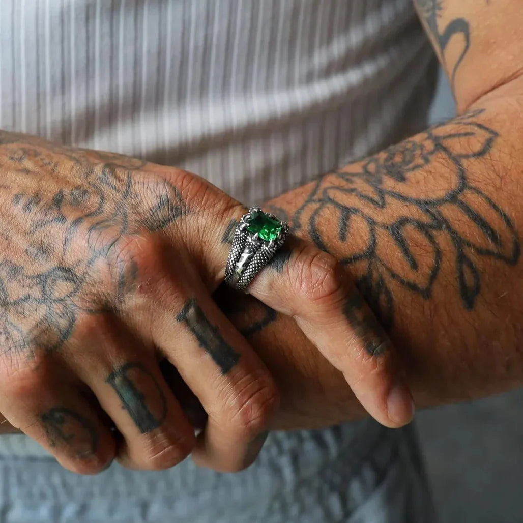 Showcasing the versatility of minimalist style, this sterling silver emerald cut zircon ring for men and women captures modern elegance and a touch of timeless sophistication. Handcrafted with precision, it’s a perfect birthstone accessory for those who value both simplicity and a bold pop of color in their jewelry.