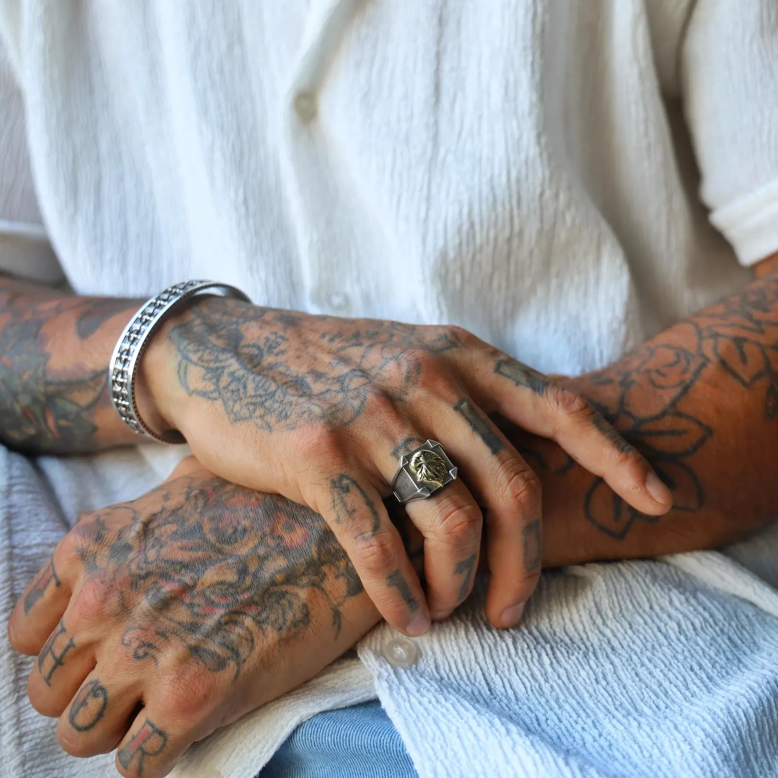 Elegant men’s pinky ring crafted from solid 925 sterling silver, with a classic signet shape and engraved cross detail, representing handcrafted Christian jewelry that blends masculine design with religious symbolism.