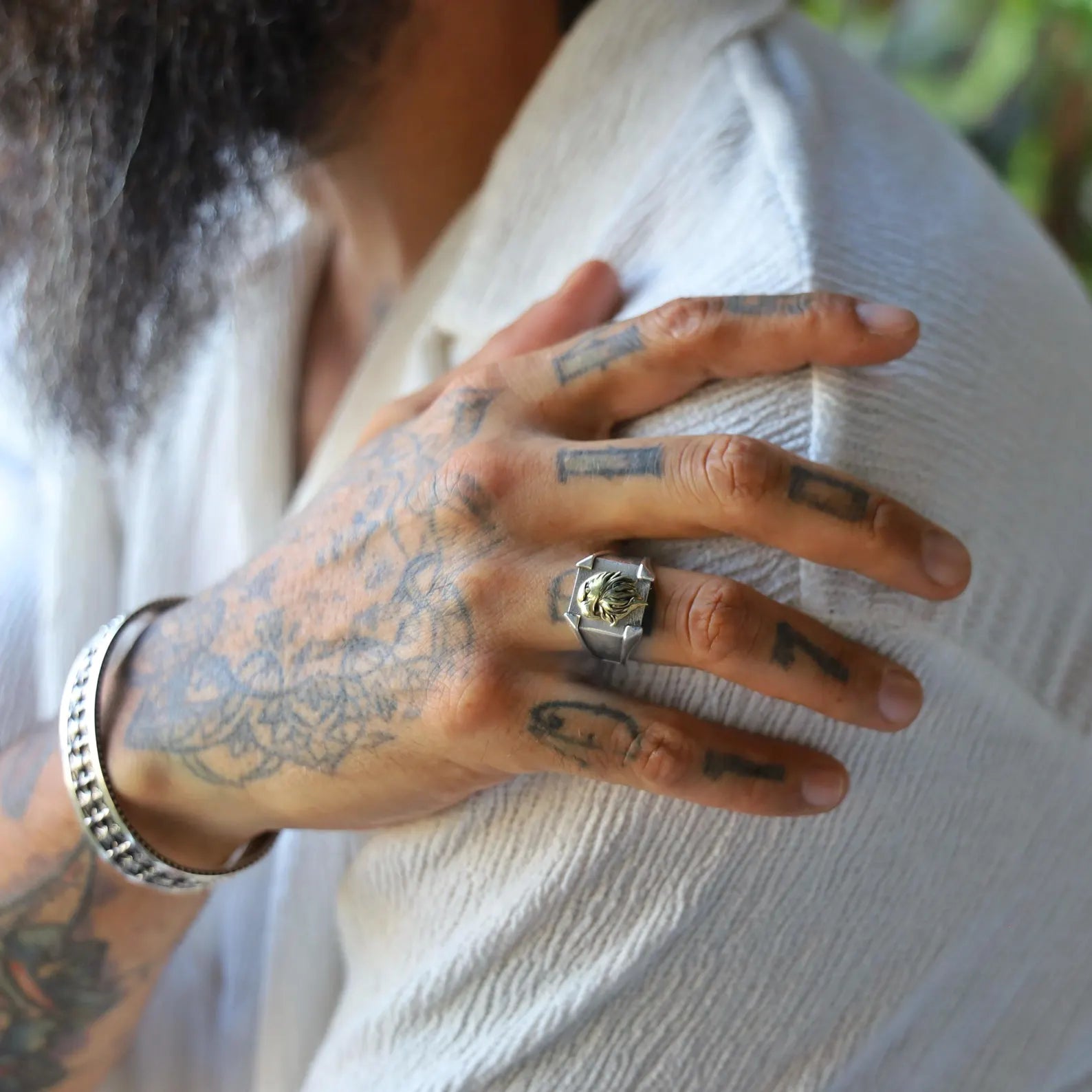 Close-up image of a handcrafted sterling silver cross signet pinky ring for men, featuring a raised Christian cross design on a polished face, symbolizing faith, tradition, and timeless spiritual strength, ideal for everyday or ceremonial wear.