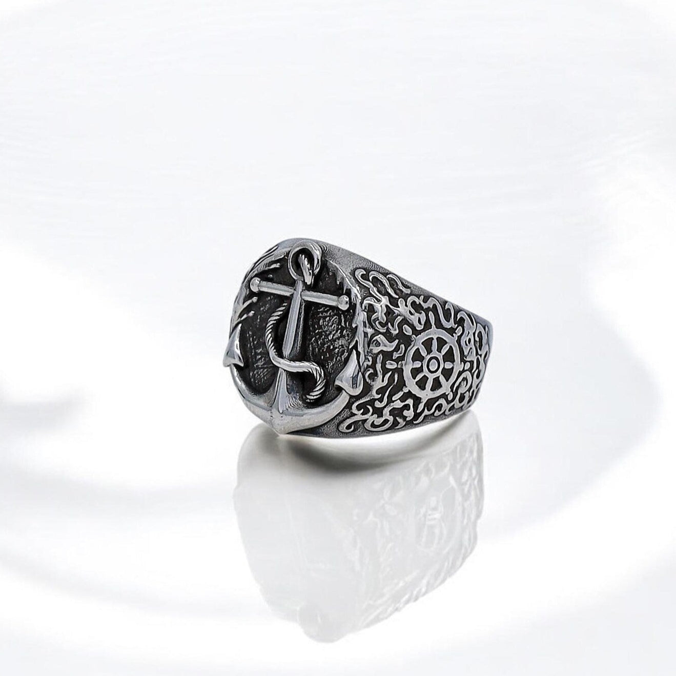 A handcrafted sterling silver anchor ring designed for men who appreciate nautical-inspired jewelry. This statement piece features a meticulously detailed anchor symbol representing strength, resilience, and a love for the ocean. Made with high-quality 925k silver, the ring reflects maritime traditions and adds a bold yet meaningful touch to any jewelry collection. Perfect for sea lovers, sailors, or anyone drawn to timeless nautical fashion.