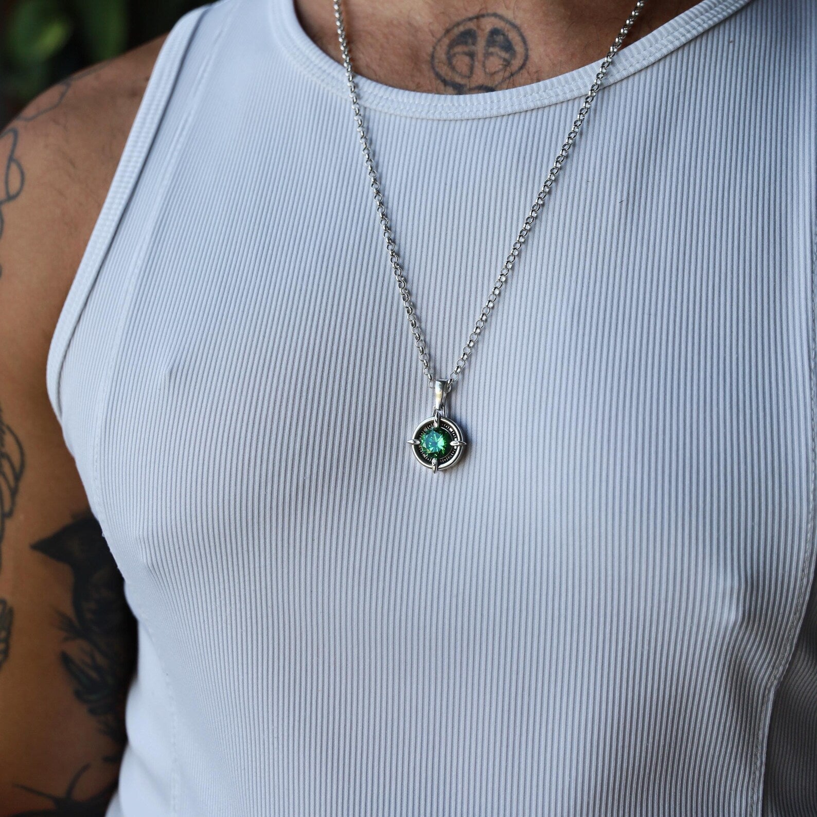 Sterling silver compass pendant handcrafted with an emerald green gemstone. This symbolic necklace represents courage, clarity, and safe journeys, making it the perfect travel-inspired gift. Ideal for adventurers, sailors, and explorers who value meaningful handmade jewelry. A thoughtful jewelry gift for birthdays, anniversaries, or special occasions.