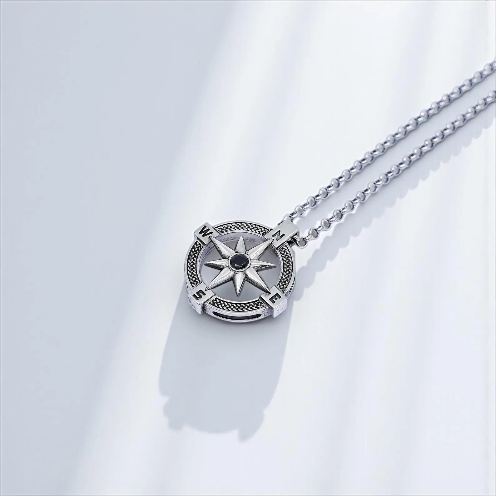 Handmade sterling silver compass necklace featuring a detailed North Star design, symbolizing guidance, protection, and exploration. This unisex nautical jewelry piece is perfect for men and women who love travel-inspired accessories. A timeless sterling silver gift for him or her, ideal for birthdays, anniversaries, or everyday wear with elegant style.