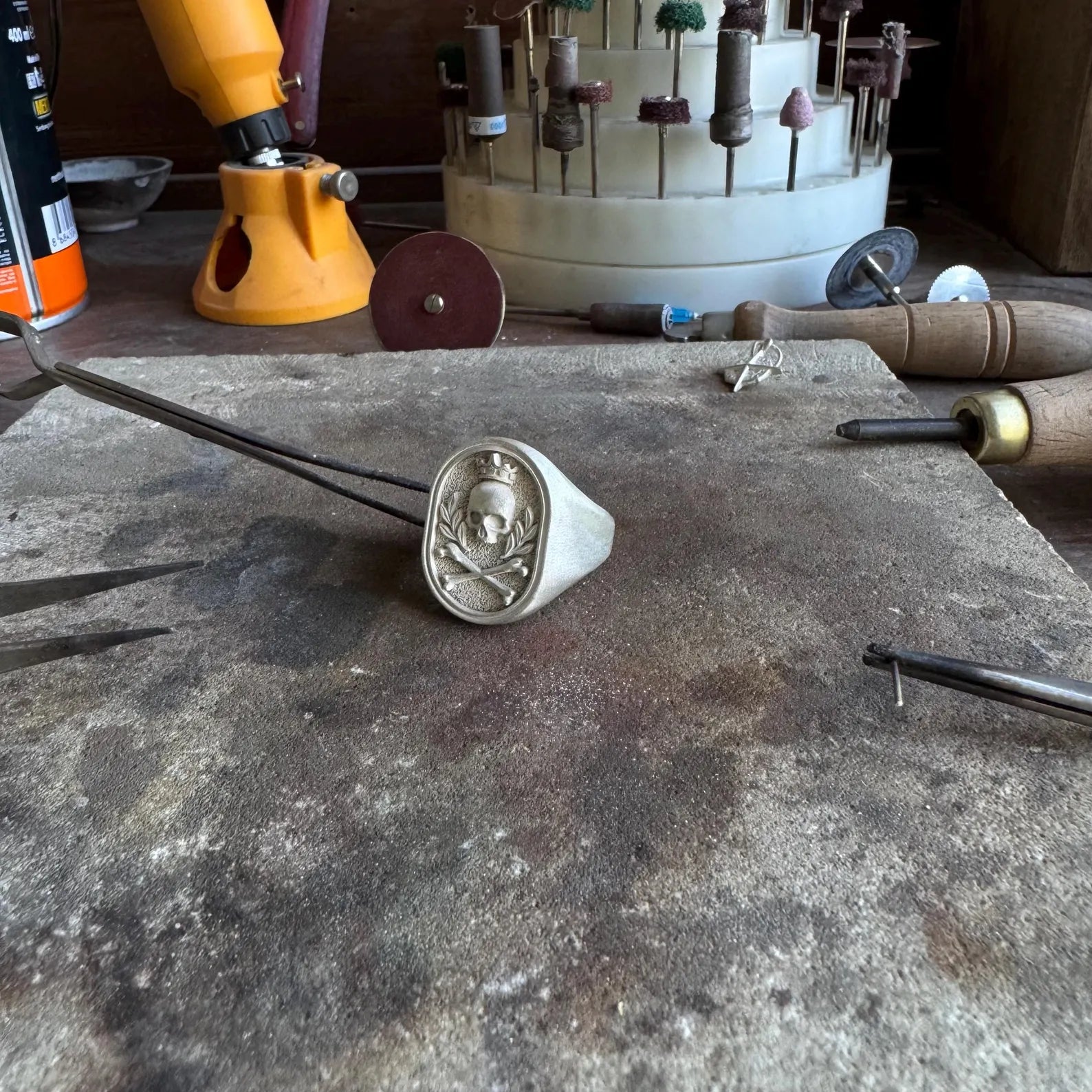 Angled side view highlighting the thick sterling silver band and deeply engraved crowned skull emblem, offering a striking statement piece that combines gothic symbolism with Harley Davidson-style attitude. The bold design makes it ideal for confident, edgy styles.