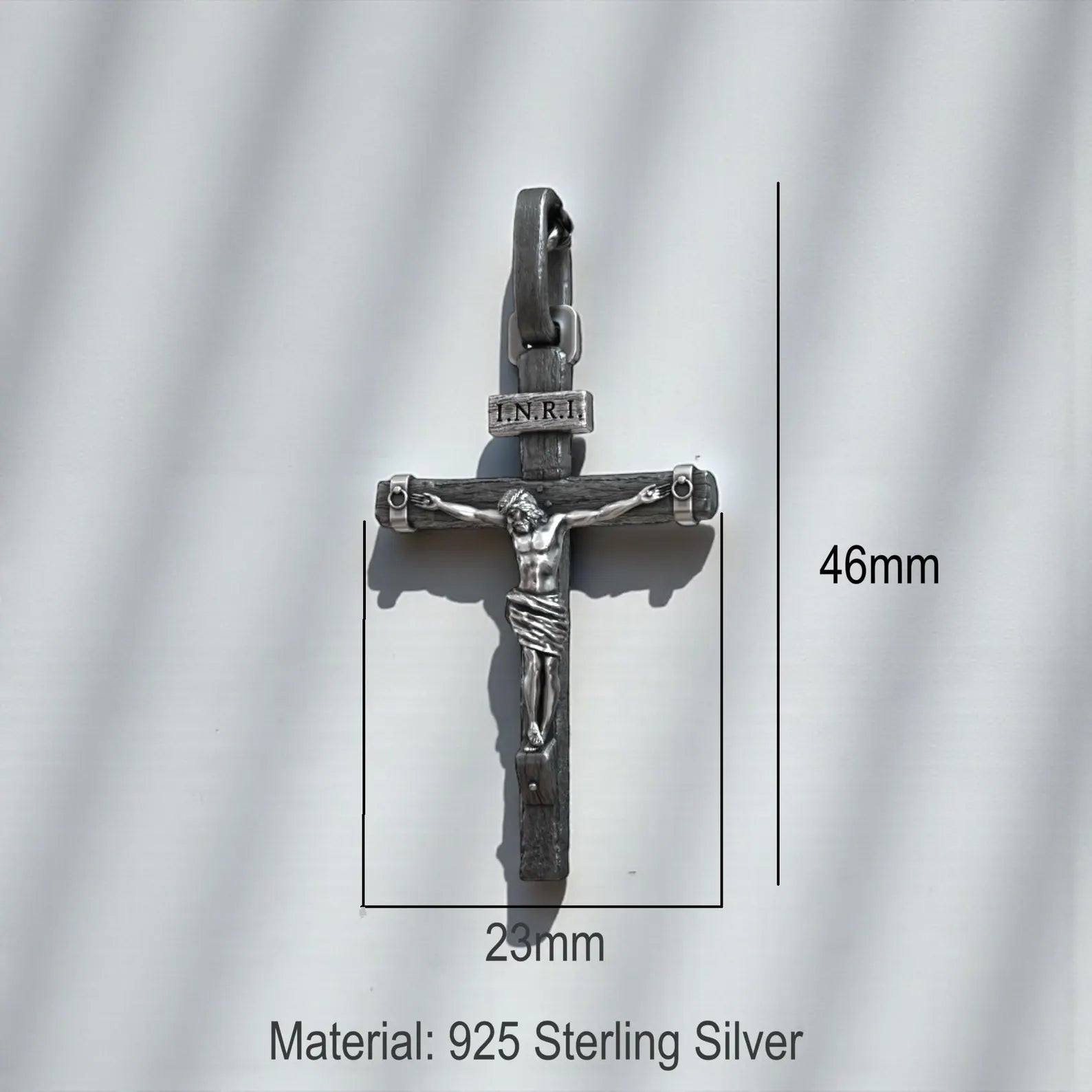 Faith-based INRI Jesus crucifix pendant necklace for men in oxidized sterling silver, symbolizing devotion, protection, and spiritual strength