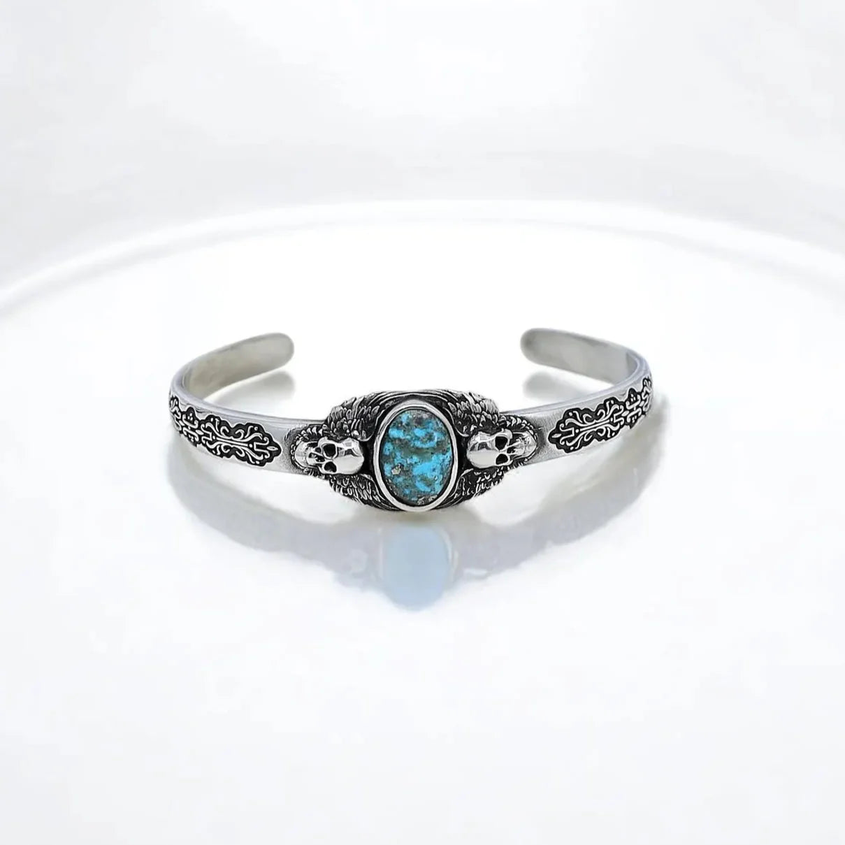 Elevate your style with this men’s turquoise stone silver bracelet featuring an intricate skull motif that captures the dark allure of gothic jewelry. Handcrafted with precision and inspired by rugged biker style and Western vibes, this bold statement piece combines masculine elegance with spiritual energy, making it an ideal accessory for those who appreciate alternative fashion and meaningful jewelry