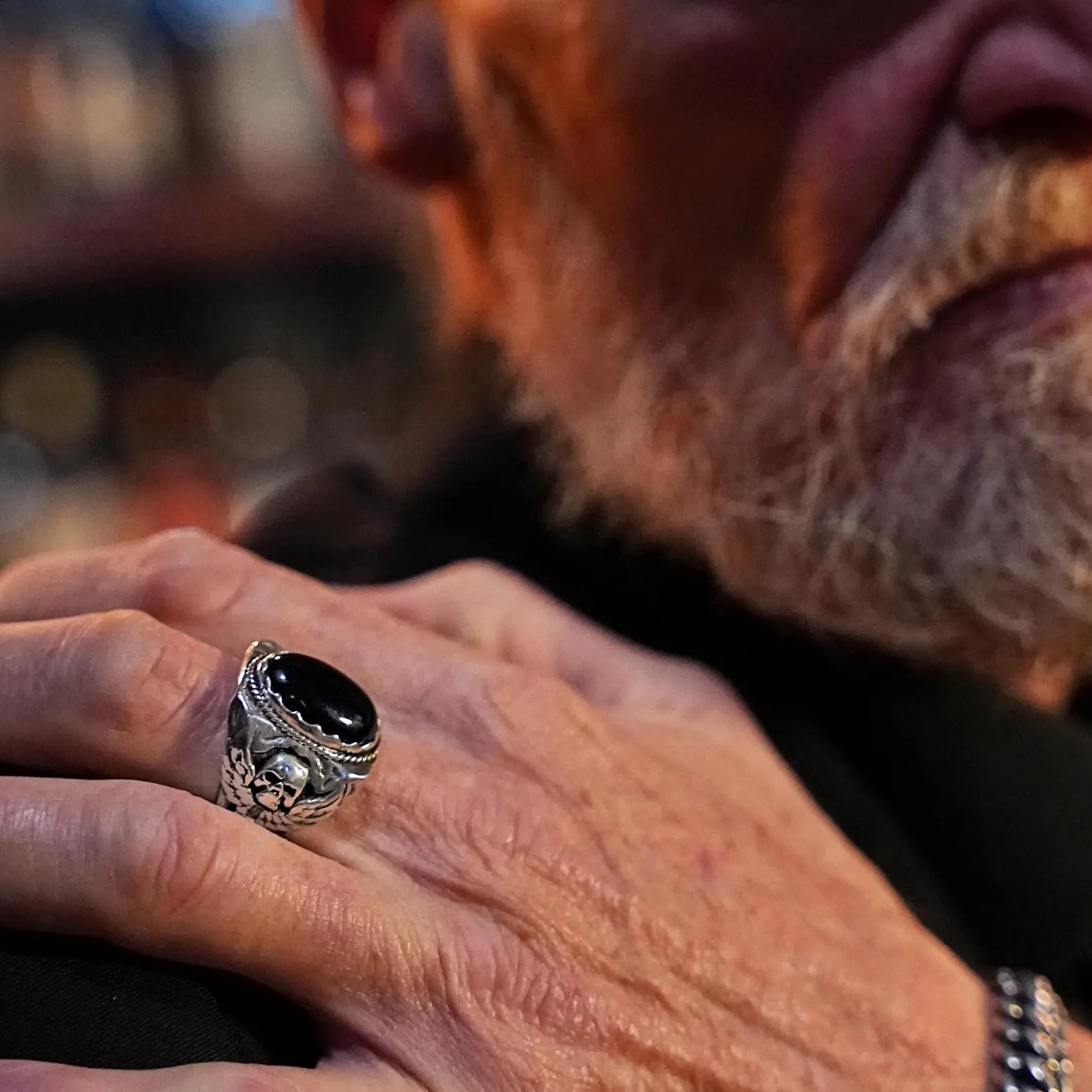 A handcrafted sterling silver ring featuring a bold skull design paired with a polished black onyx gemstone. This gothic biker ring combines detailed craftsmanship and dark elegance, making it a must-have accessory for men who express strength and rebellion through jewelry.
