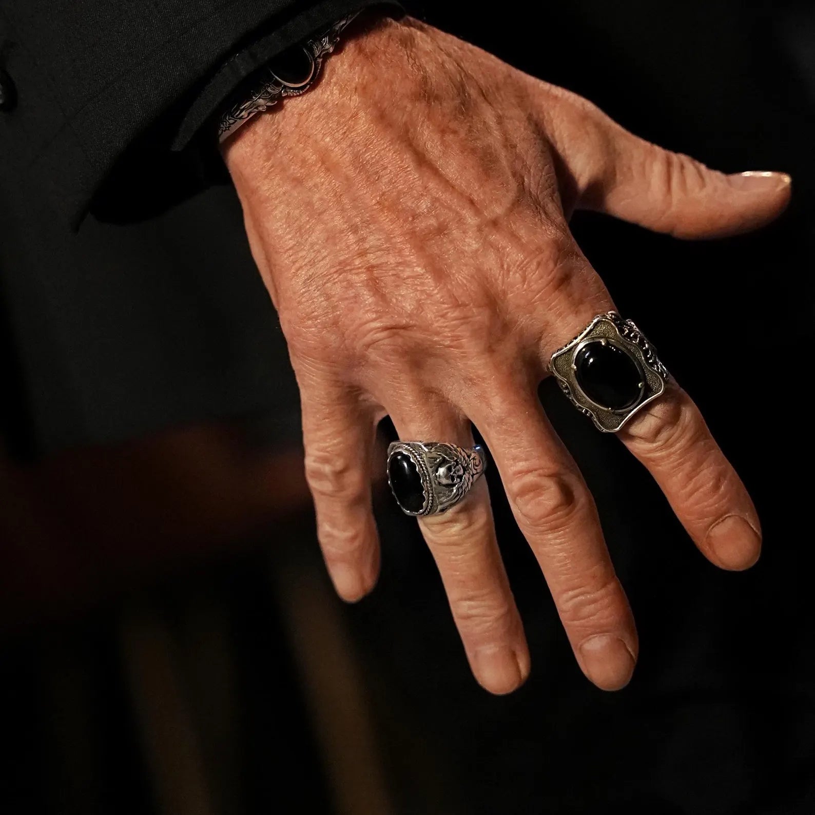 Sterling silver gothic skull ring with a black onyx center stone, designed for men who embrace alternative fashion. This edgy statement piece blends rock-inspired symbolism with luxurious handcraftsmanship, ideal for birthdays, anniversaries, or personal milestones.