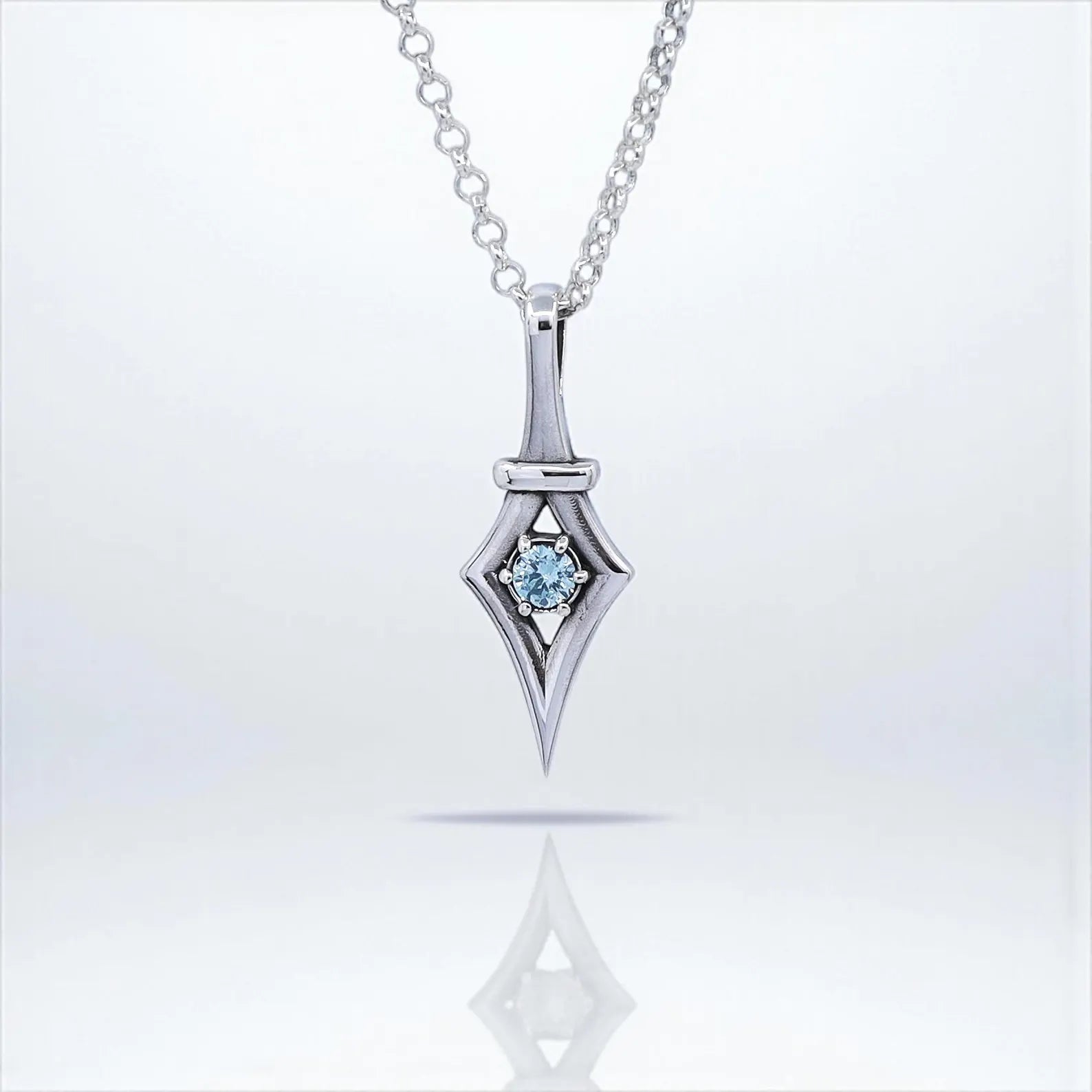 Minimalist sterling silver necklace featuring a handcrafted gothic pendant with a sparkling aquamarine gemstone. This unique design blends elegance with bold gothic style, making it the perfect jewelry gift for her. A meaningful March birthstone necklace ideal for birthdays, anniversaries, or special occasions.