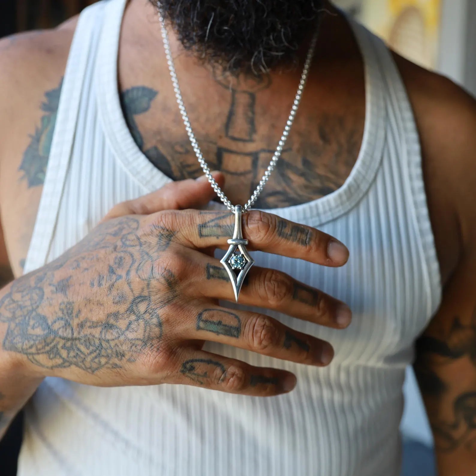 Handmade sterling silver gothic pendant necklace with a natural aquamarine gemstone centerpiece. Designed with a minimalist yet edgy aesthetic, this artisan-crafted jewelry symbolizes strength, clarity, and individuality. A unique March birthstone gift for women who love bold, artistic jewelry.