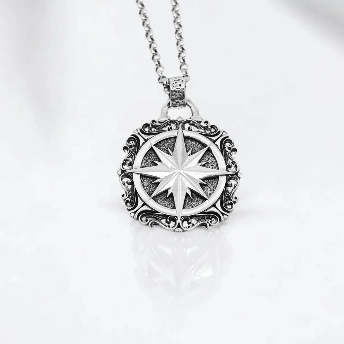 Handcrafted sterling silver compass pendant necklace featuring a large, intricately designed nautical medallion. With a bold 42g weight and 2.36-inch height, this statement piece is perfect for men and women who appreciate rustic elegance and symbolic jewelry. A timeless accessory inspired by travel, direction, and the strength of the inner compass—ideal for wanderers and spiritual seekers.