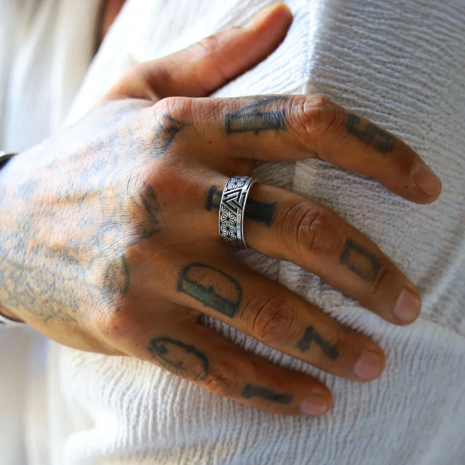 Elegant Viking ring made of 925 sterling silver with a bold Valknut design in the center, representing bravery and the afterlife in Norse mythology. This men's band offers a balance between ancient symbolism and modern style, making it a timeless piece of spiritual and masculine jewelry.