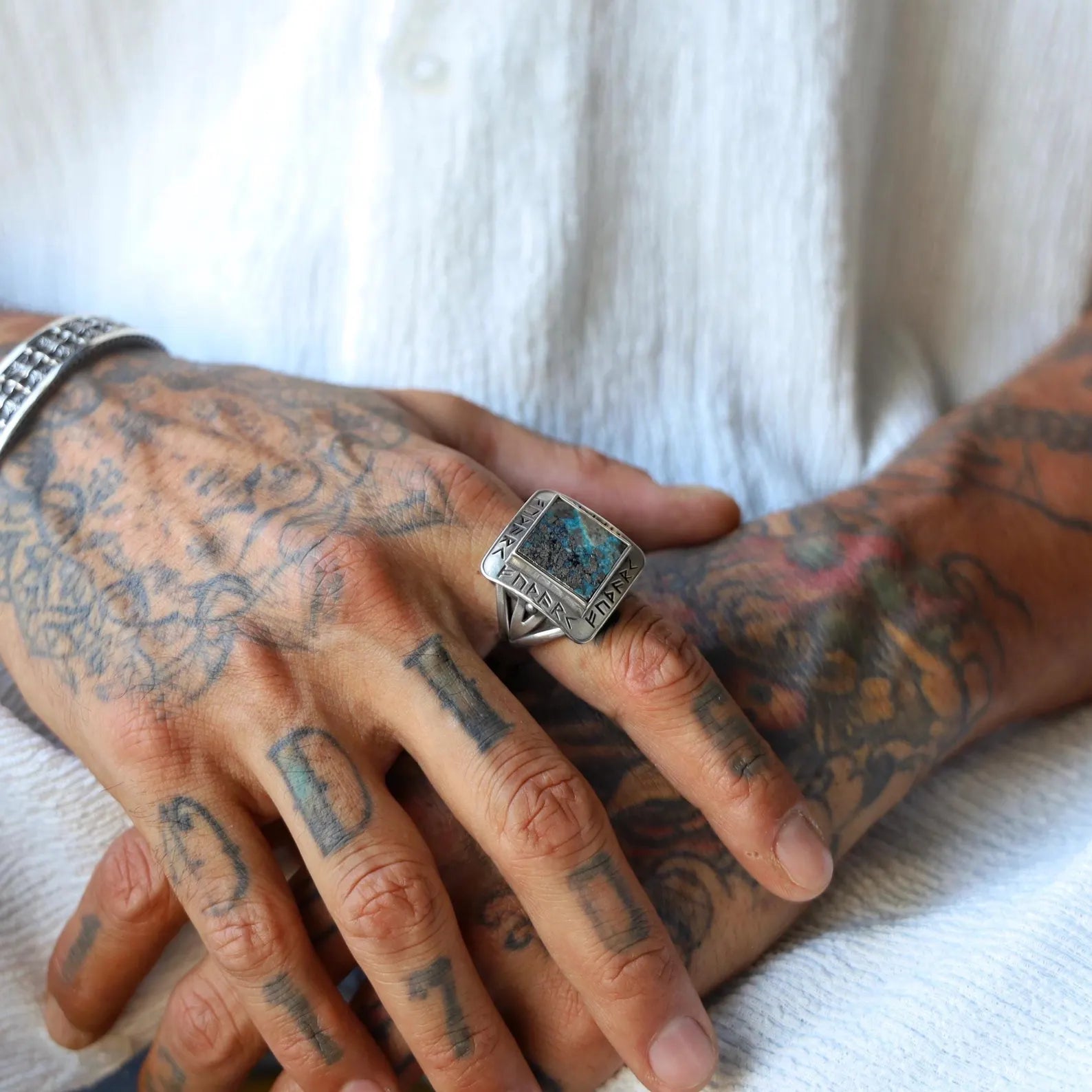 Handcrafted sterling silver Viking ring for men featuring a bold square-cut turquoise stone and ancient runic inscriptions. This unique Nordic ring blends mythological design with modern masculinity. Perfect as a birthday or anniversary gift for him. Ideal for Pinterest boards and Shopify Viking collections.