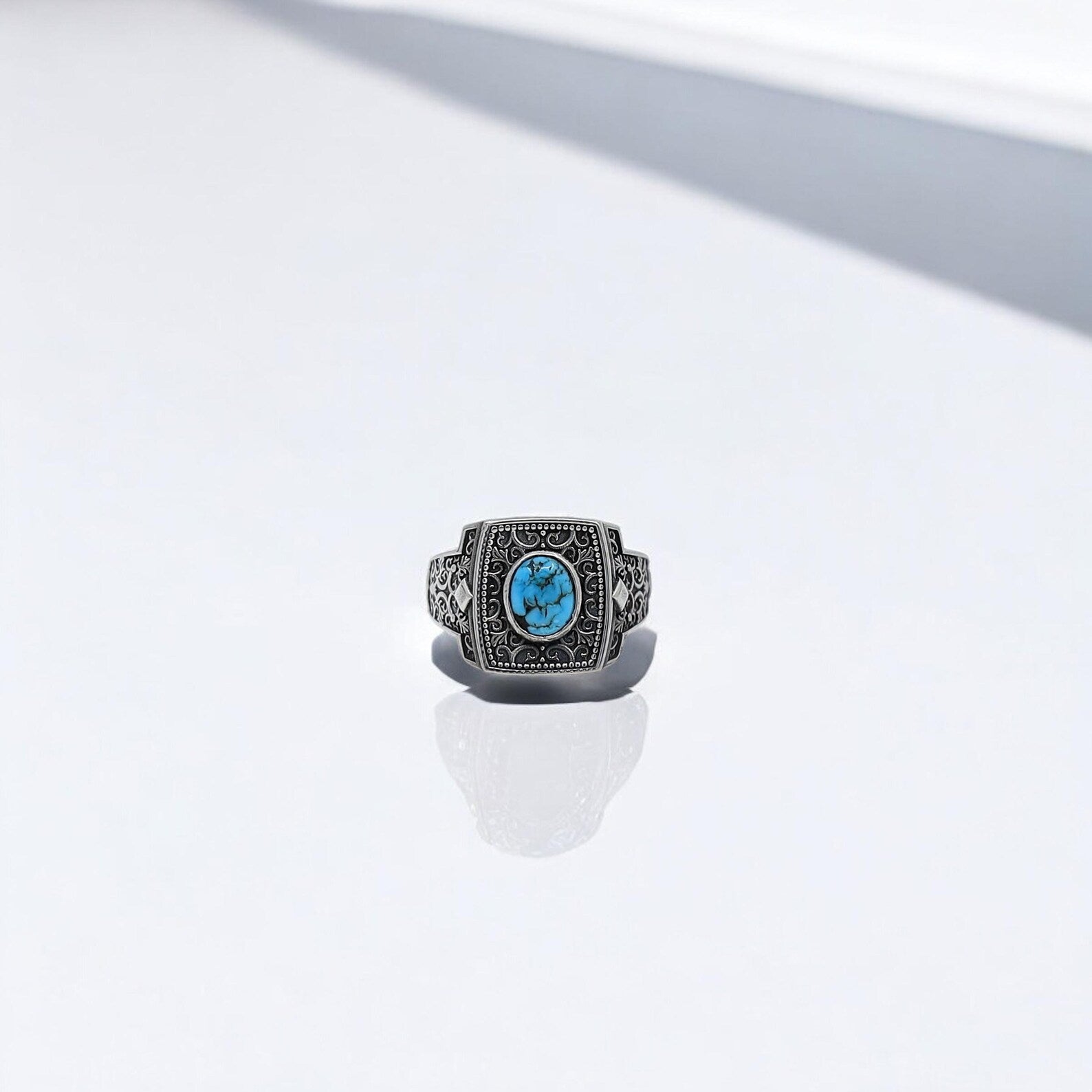 Artisan-crafted turquoise silver ring for men with detailed engravings on the band and a genuine turquoise gemstone centerpiece. Ideal for birthdays, anniversaries, or Father's Day gifts for those who love handcrafted boho and western jewelry.
