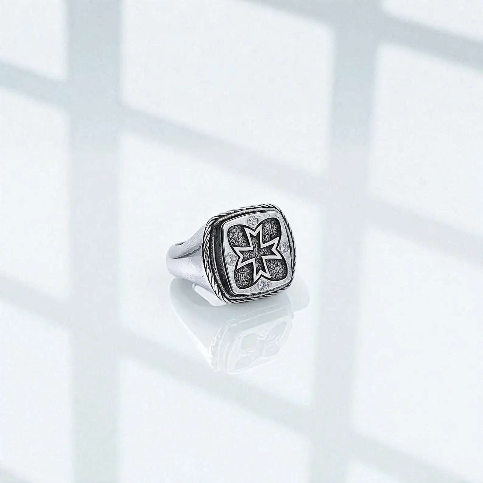 Handcrafted sterling silver pinky ring for men featuring an oxidized finish and a bold medieval cross signet, designed for those seeking unique Christian statement jewelry.