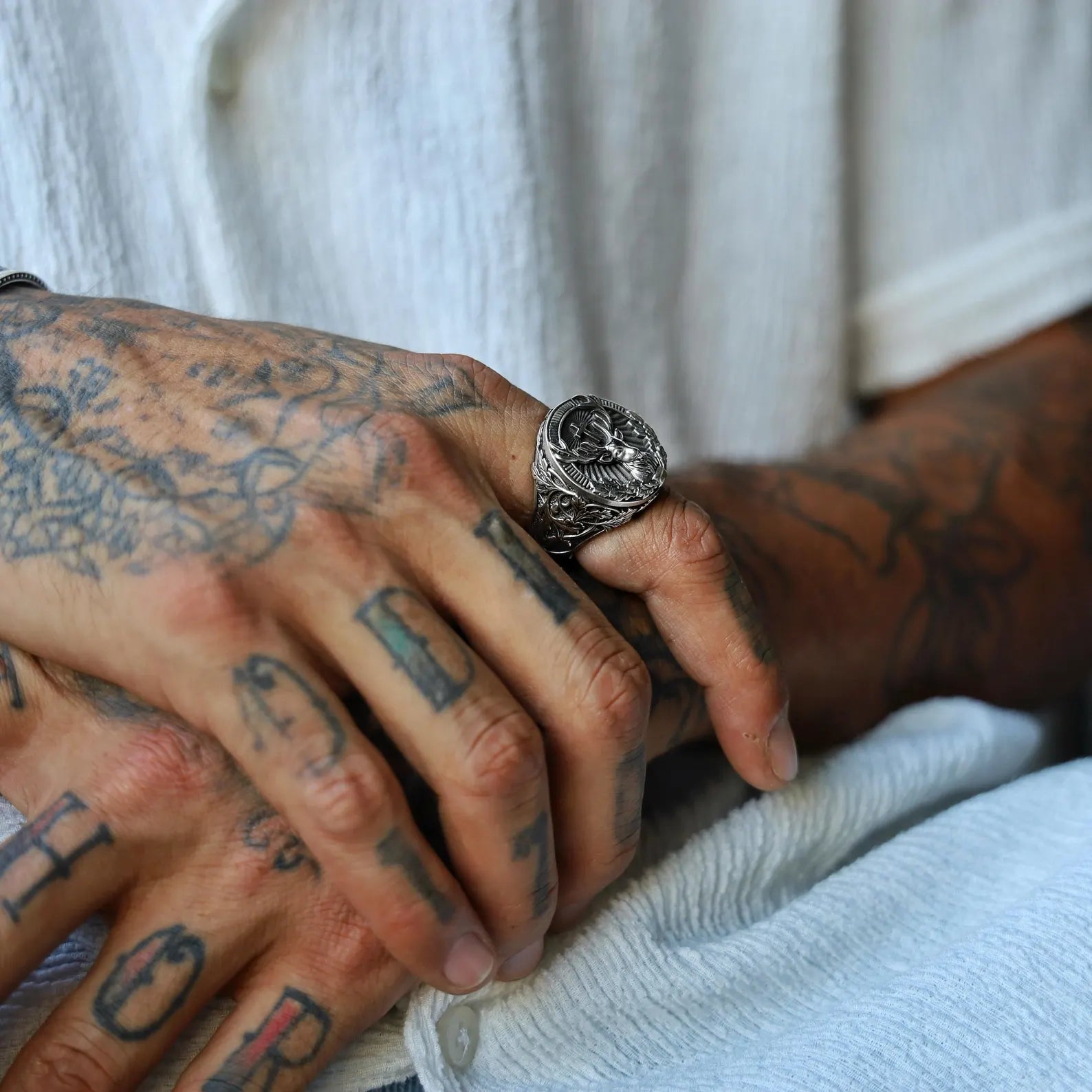 Artisan-crafted deer ring made from 925 sterling silver, showcasing a regal stag framed by detailed forest foliage, designed for men who appreciate gothic nature symbolism and statement jewelry.