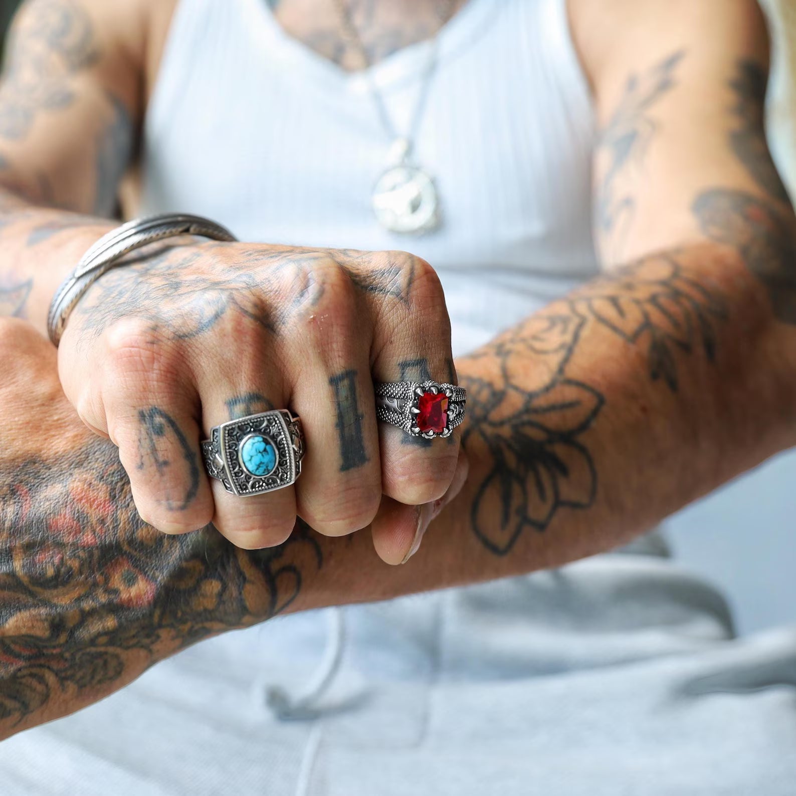 Set against a minimalist white background, this emerald cut ruby stone sterling silver ring stands out as a bold yet refined accessory. Designed for men and women who love minimalist jewelry, this piece captures the essence of modern elegance and timeless sophistication, adding a touch of luxury to any jewelry collection.