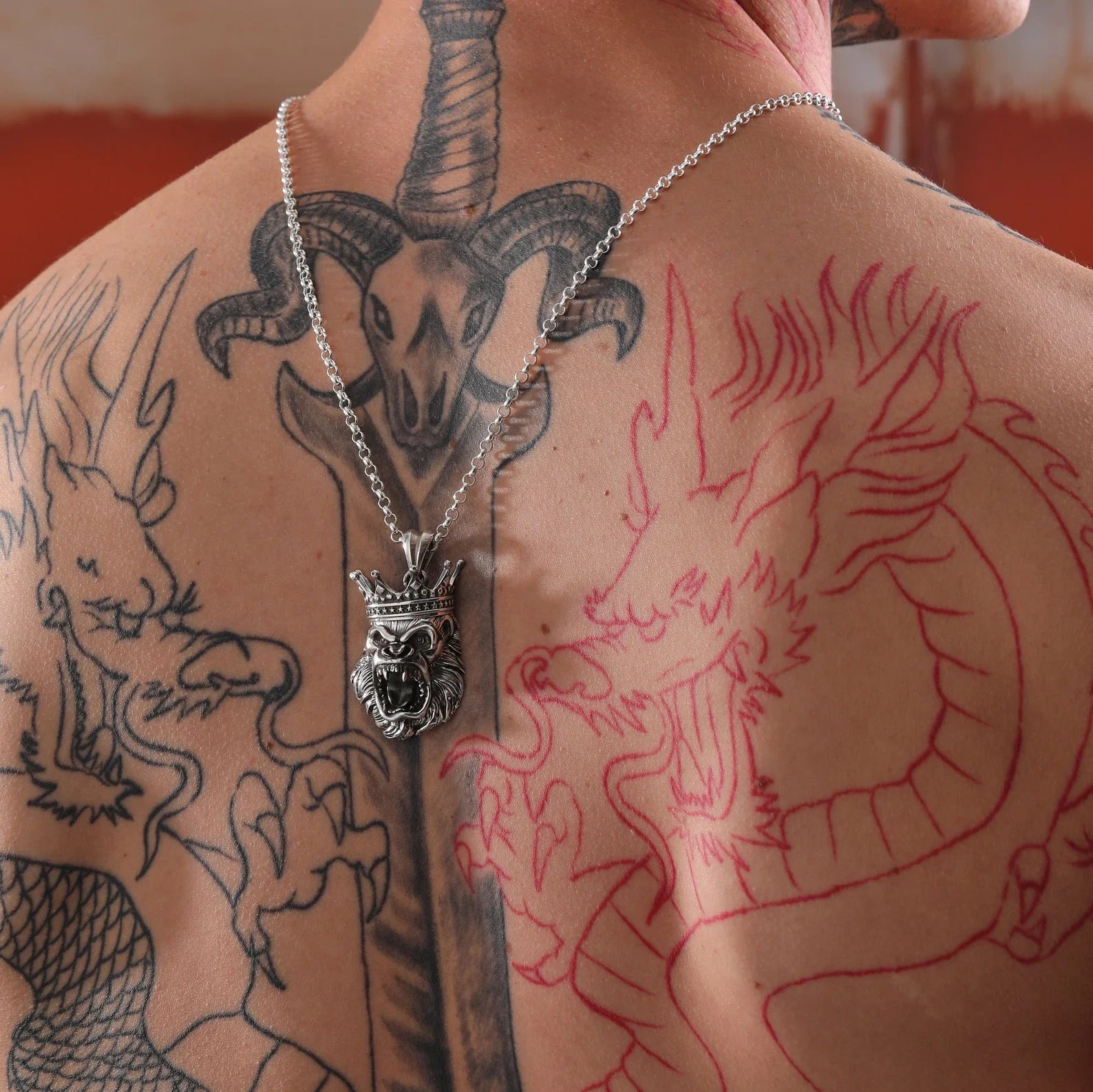 Command presence with this handcrafted silver gorilla necklace featuring a crowned king of the jungle. Designed for men who thrive on strength, loyalty, and style, this piece blends artistry with masculine energy. The roaring gorilla pendant represents unshakable leadership and primal force, making it a top pick for men who wear their beliefs and instincts on their chest. A perfect gift for him — whether he’s a king in the gym, at home, or on the road.