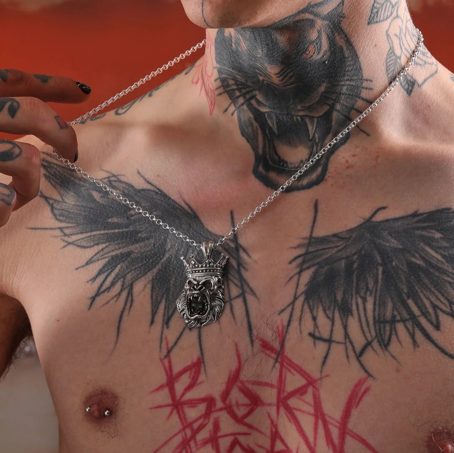 A commanding sterling silver gorilla pendant that celebrates the primal power and majestic authority of one of nature’s most powerful creatures. This handcrafted necklace features a roaring gorilla crowned like a king, merging gothic boldness with tribal elegance. Ideal for lovers of animal symbolism, jungle mythology, and statement accessories. It’s the kind of necklace that tells a story of strength, honor, and individuality — making it a top gift choice for stylish, confident men.