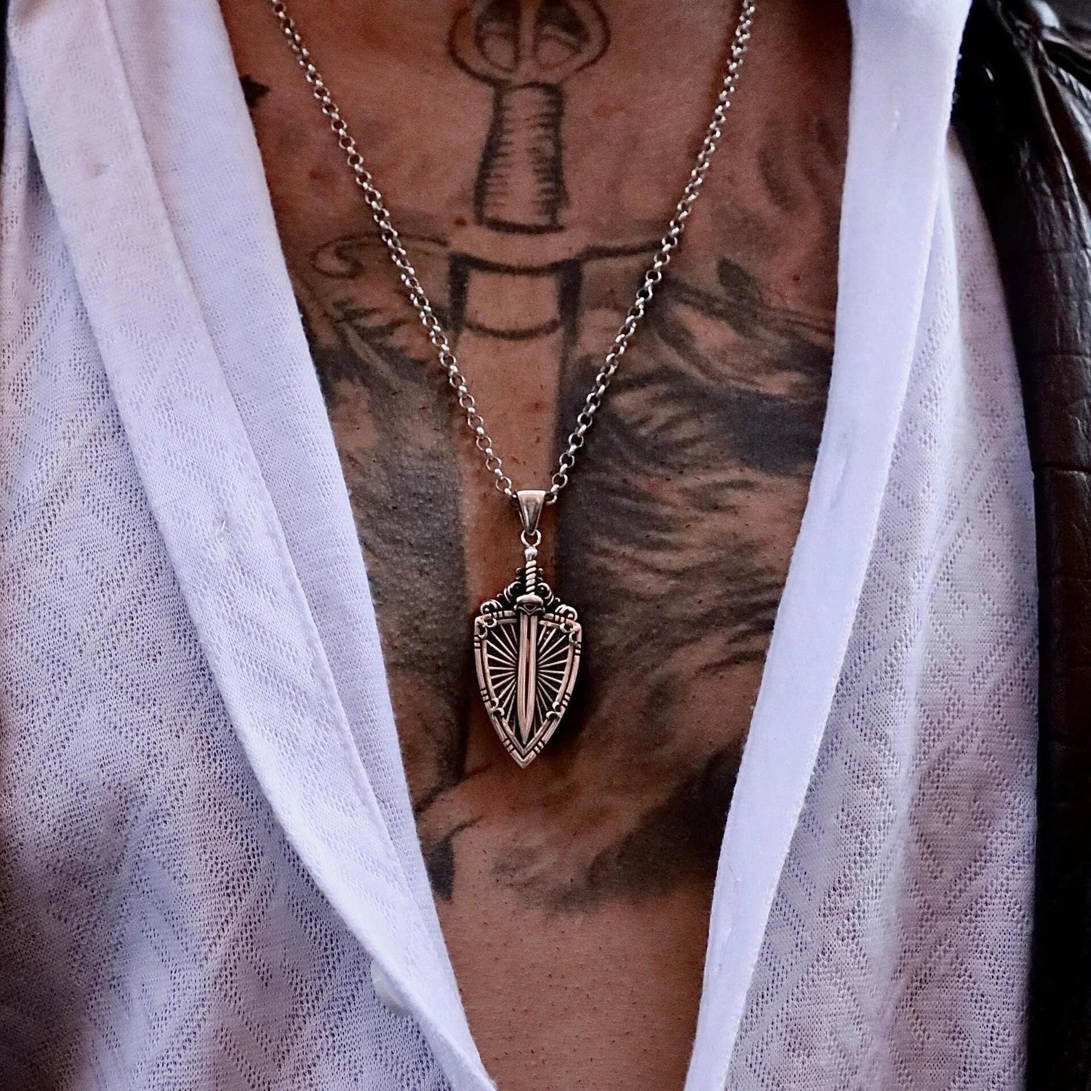 Unique men’s silver sword pendant necklace with medieval shield design, handcrafted with fine details for knights, vikings, and fantasy lovers. A perfect jewelry gift for birthdays, anniversaries, or roleplay events, adding strength and elegance to any outfit.