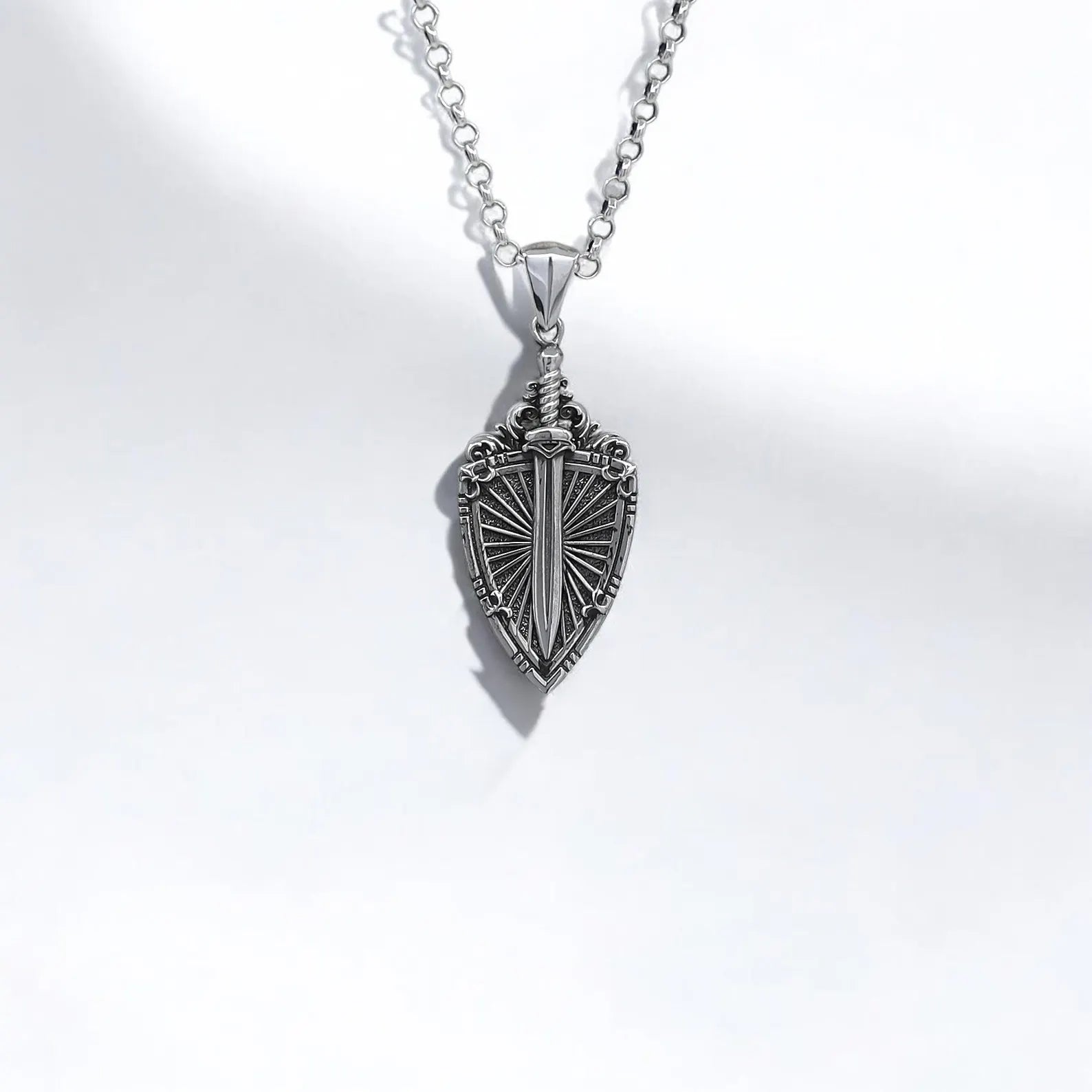 Sterling silver medieval sword and shield men’s necklace, knight-inspired design with intricate detailing, perfect gift for men who love medieval, gothic, or fantasy style jewelry. Durable craftsmanship with a bold warrior look, ideal for cosplay, collectors, and daily wear.