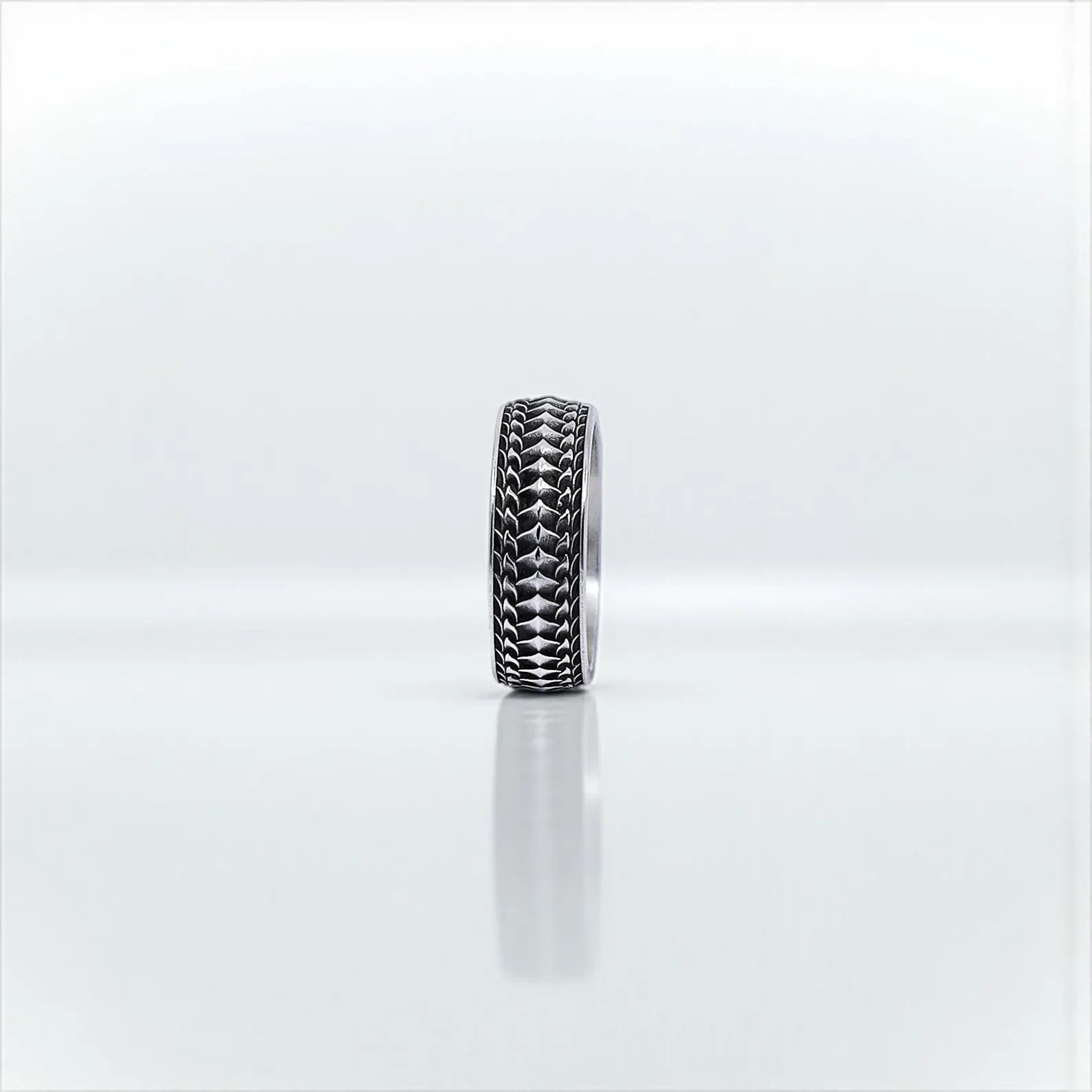 A wide, textured band ring made of solid sterling silver, designed for men who love gothic aesthetics and clean minimalism. A great pick for wedding bands or special occasion gifts. Ideal for Instagram carousel posts and Pinterest handmade ring guides.