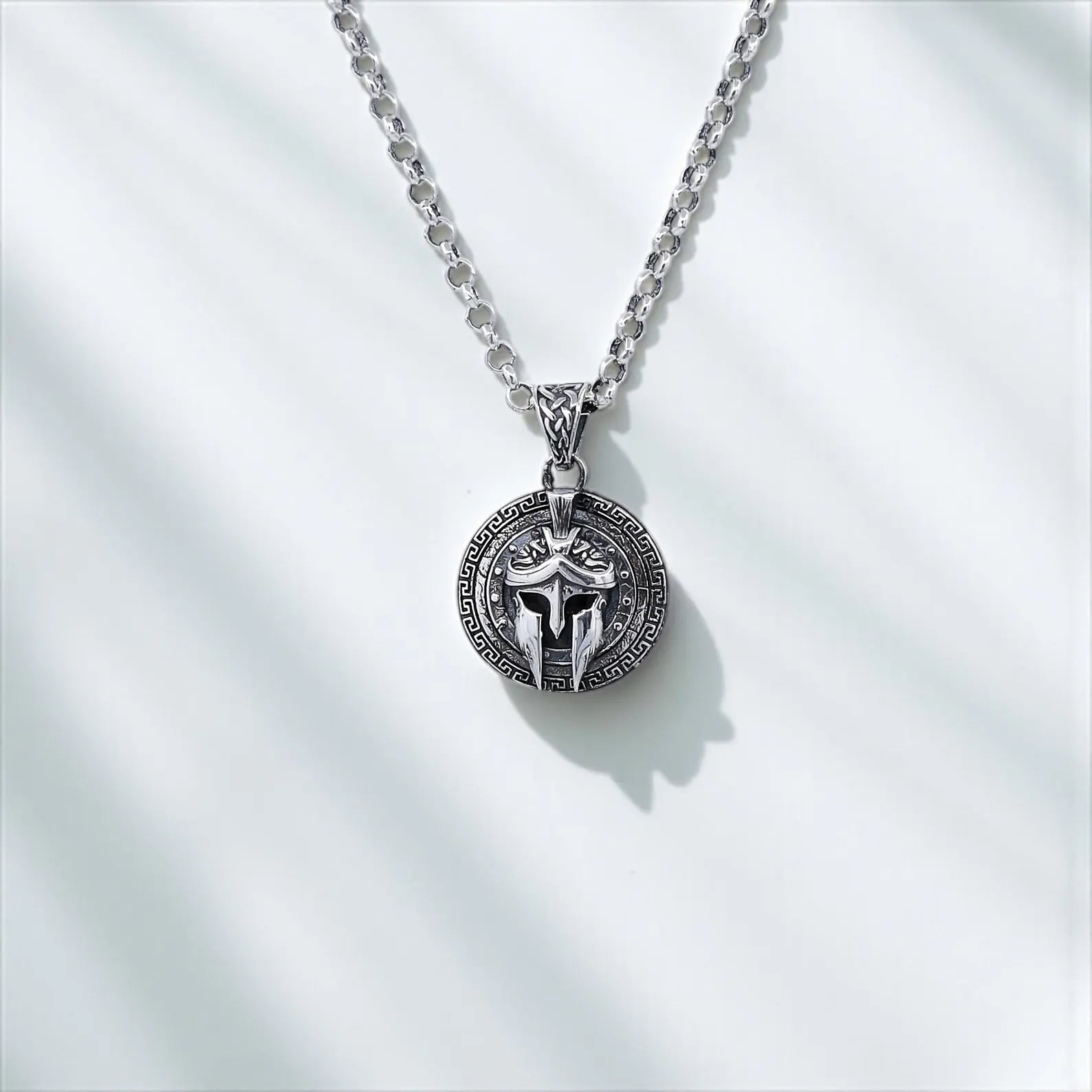 Handcrafted sterling silver necklace featuring a Spartan warrior helmet with shield detailing. Inspired by ancient Greek armor, this bold pendant is a perfect gift for men who admire history, strength, and mythology. Ideal for Shopify warrior jewelry pages, Pinterest gift boards, and Google image search.