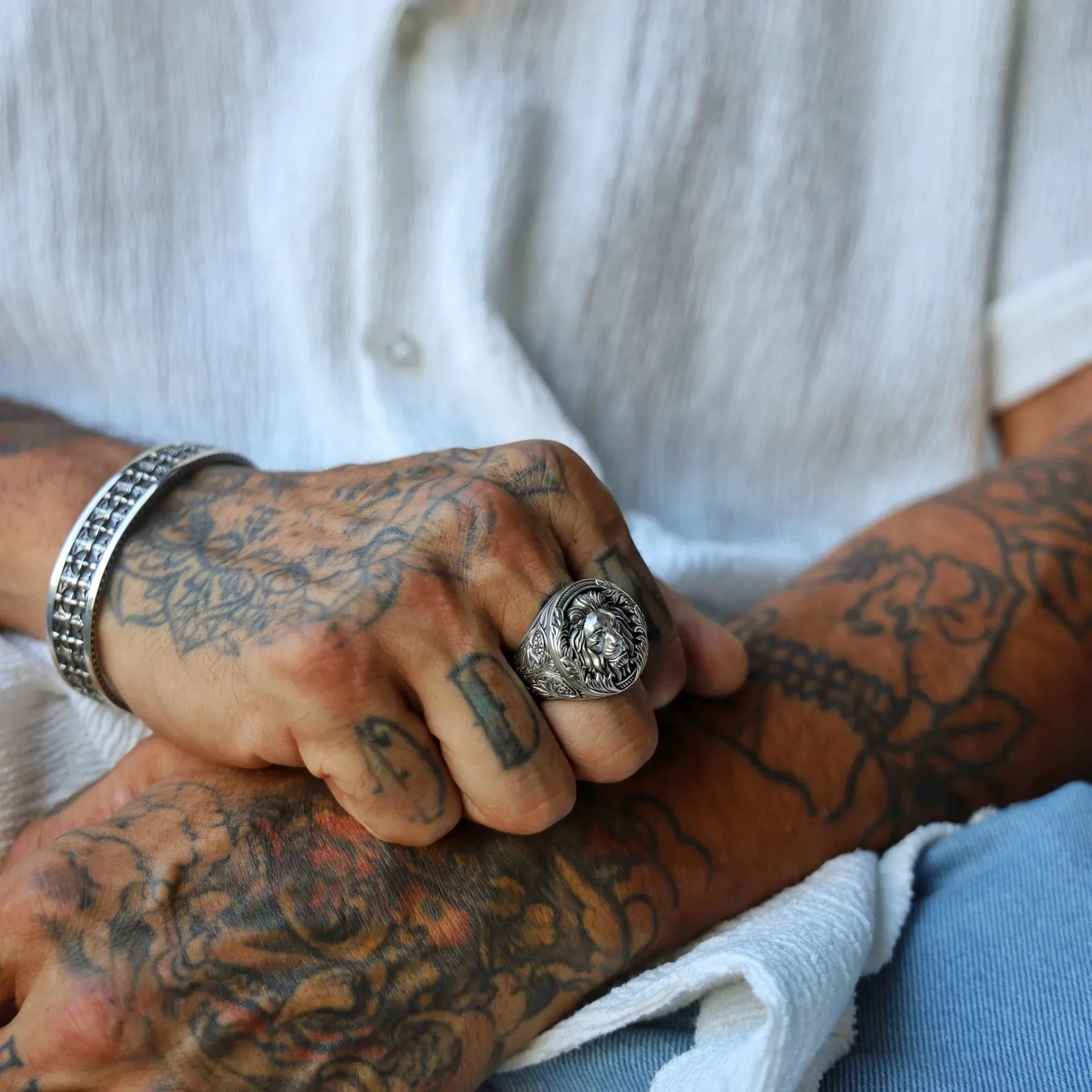 Close-up image of a sterling silver royal lion ring for men, featuring a powerful lion head design with a gothic jungle-inspired aesthetic, handcrafted to reflect strength, dominance, and timeless masculine elegance.