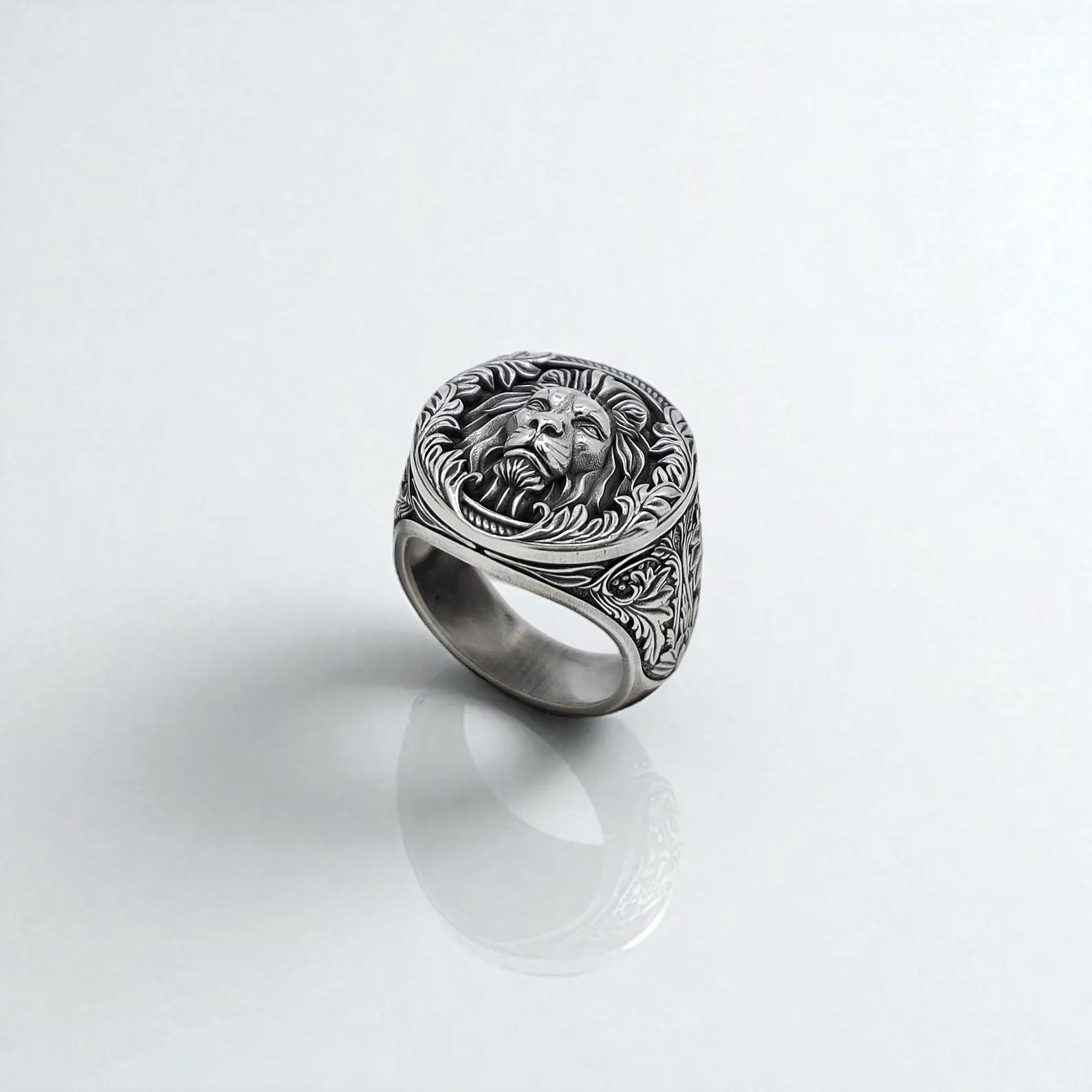 Detailed image of a gothic lion signet ring featuring sharp engraving lines and smooth silver finish. The unique design represents the spirit of the jungle and timeless masculine energy.