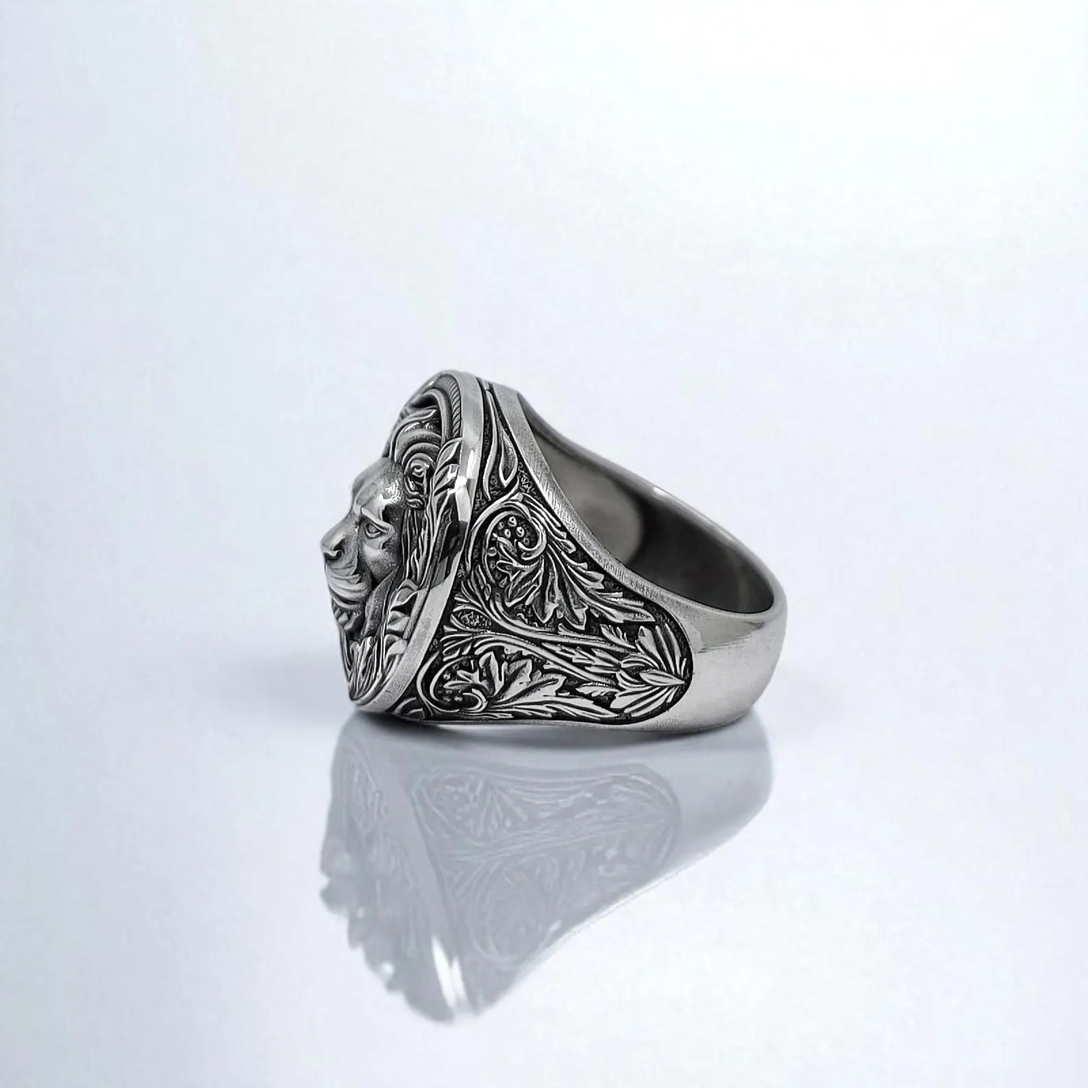 A bold handcrafted sterling silver lion ring featuring a detailed roaring lion head surrounded by intricate gothic jungle patterns. This statement piece reflects strength, courage, and regal style, perfect for men who embrace symbolic animal jewelry.