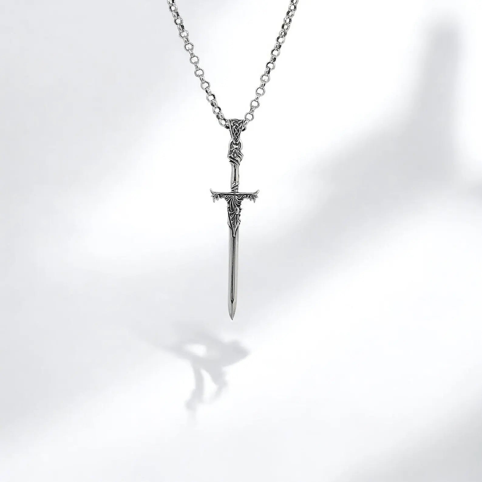 Fantasy-themed sword pendant necklace in solid sterling silver, inspired by gothic legends and heroic knights. Designed for modern men who value meaningful jewelry, this necklace evokes a deep connection to ancient power and warrior codes, making it a perfect gift for birthdays, anniversaries, or personal milestones.