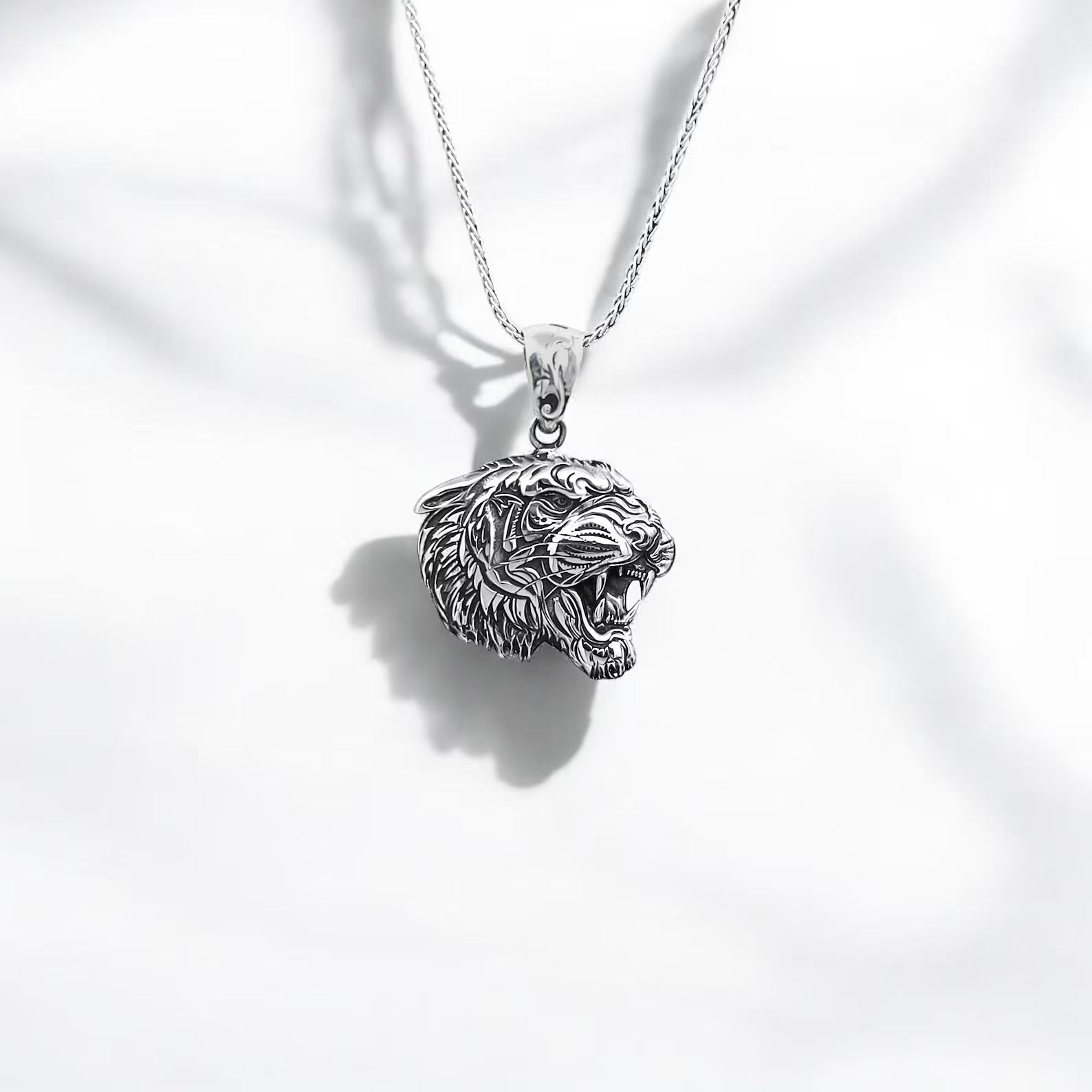 Handcrafted sterling silver tiger head necklace featuring an intricately detailed design that symbolizes courage, power, and elegance. This bold pendant is the perfect men’s accessory for those who embrace their inner warrior. A standout piece in handmade animal-themed jewelry, ideal for everyday wear or special occasions.