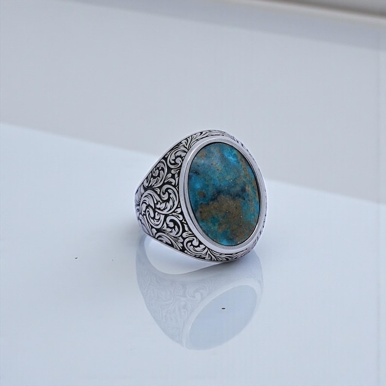 Handcrafted Baroque floral signet ring for men made from solid 925 sterling silver, featuring an 18x13mm natural turquoise gemstone with vibrant blue-green tones