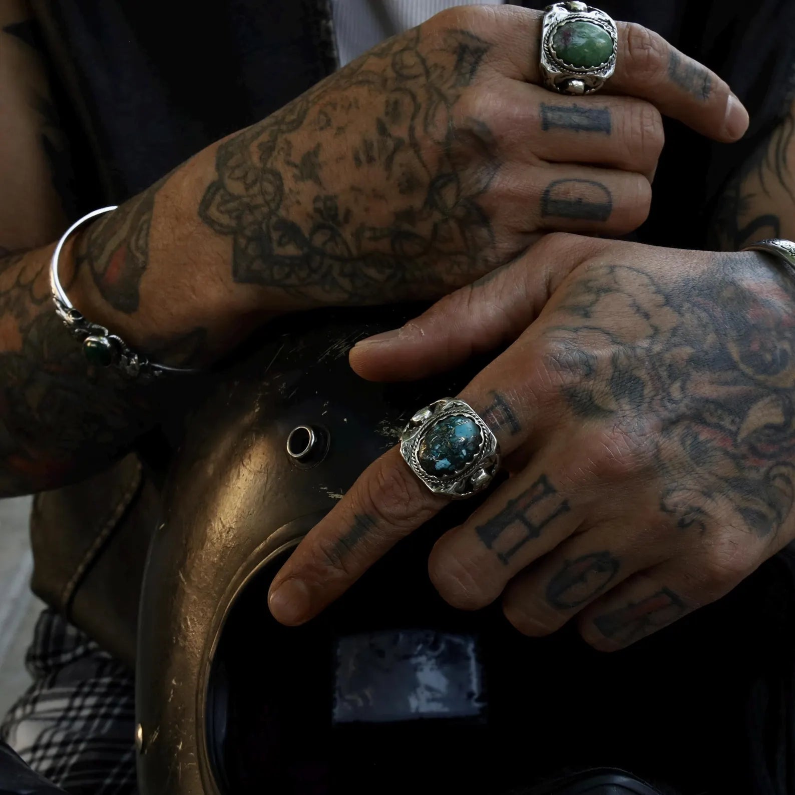 Sterling silver gothic statement ring with turquoise center stone, ideal for men who embrace spiritual symbolism and rugged style. The dark oxidized finish and detailed skull engravings reflect transformation, strength, and inner power.