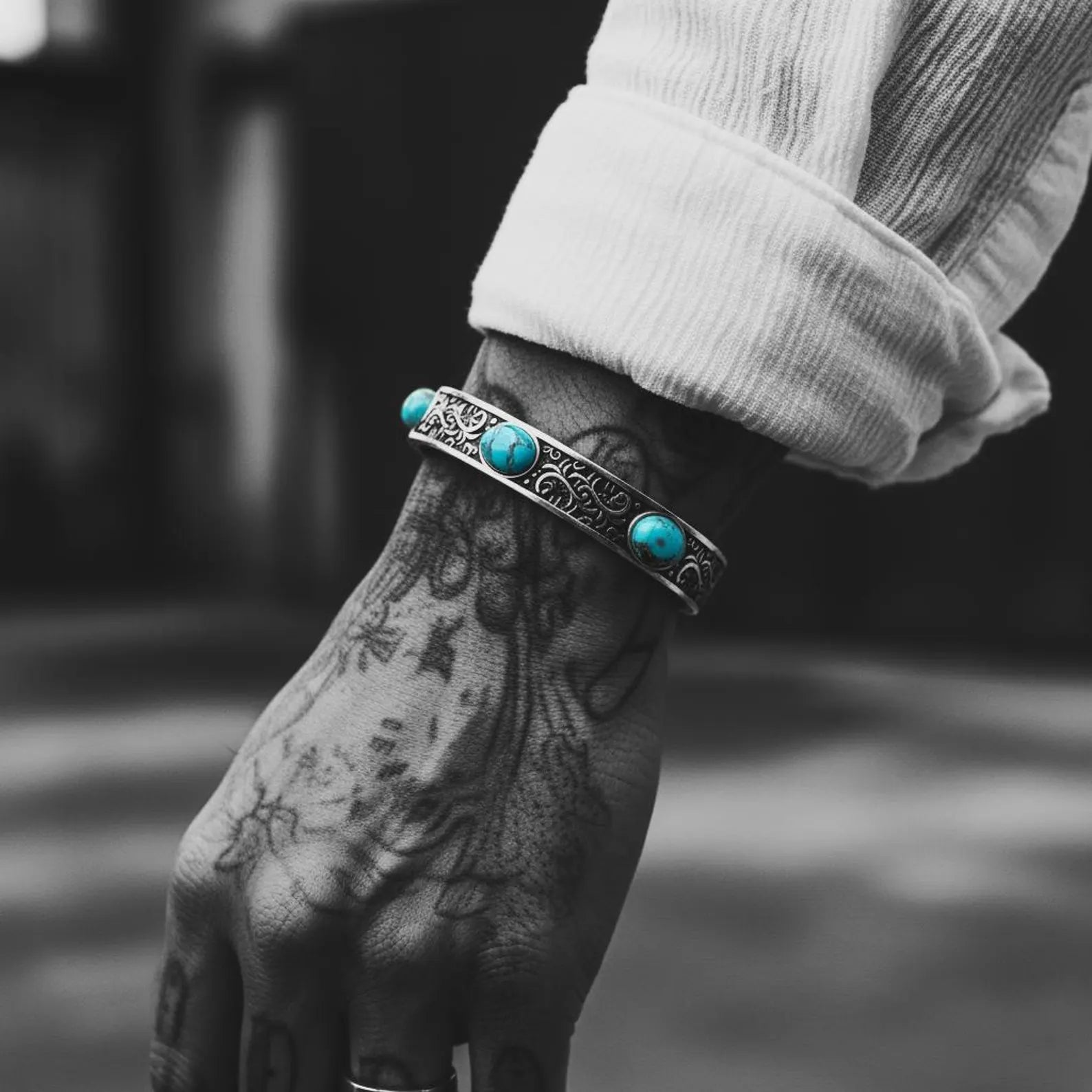 Premium 925 sterling silver men’s cuff bracelet with vibrant turquoise cabochons, oxidized Western-inspired design, and detailed engraved patterns. Adjustable Southwestern turquoise bracelet for boho style lovers seeking unique handmade gemstone jewelry.