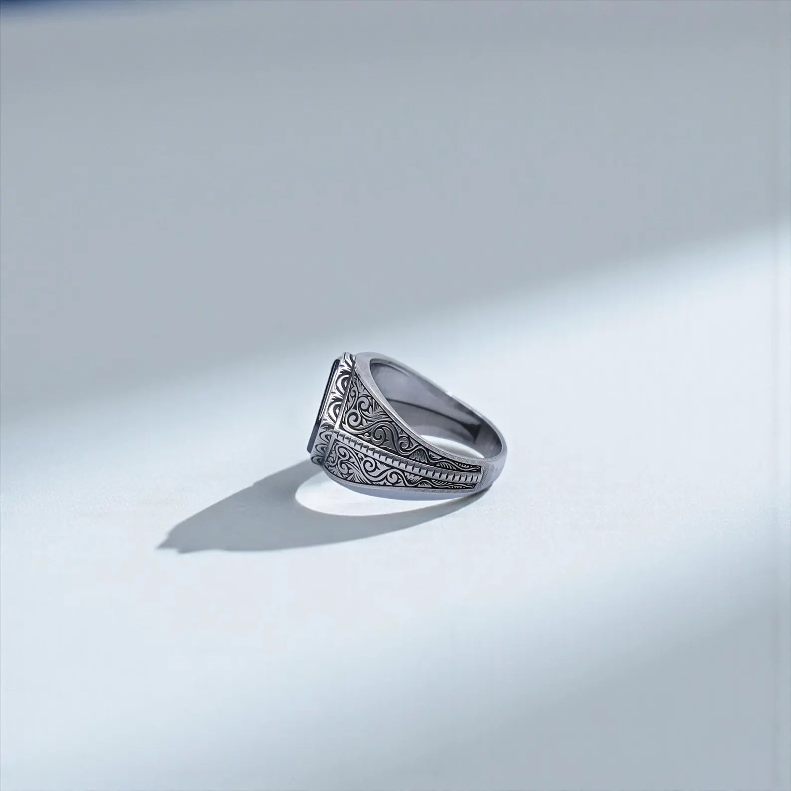 Close-up of a luxury men’s black onyx signet ring showing the inner band thickness, baroque engravings, and natural gemstone, ideal for SEO phrases like “high-quality silver ring men” and “handmade onyx signet.”