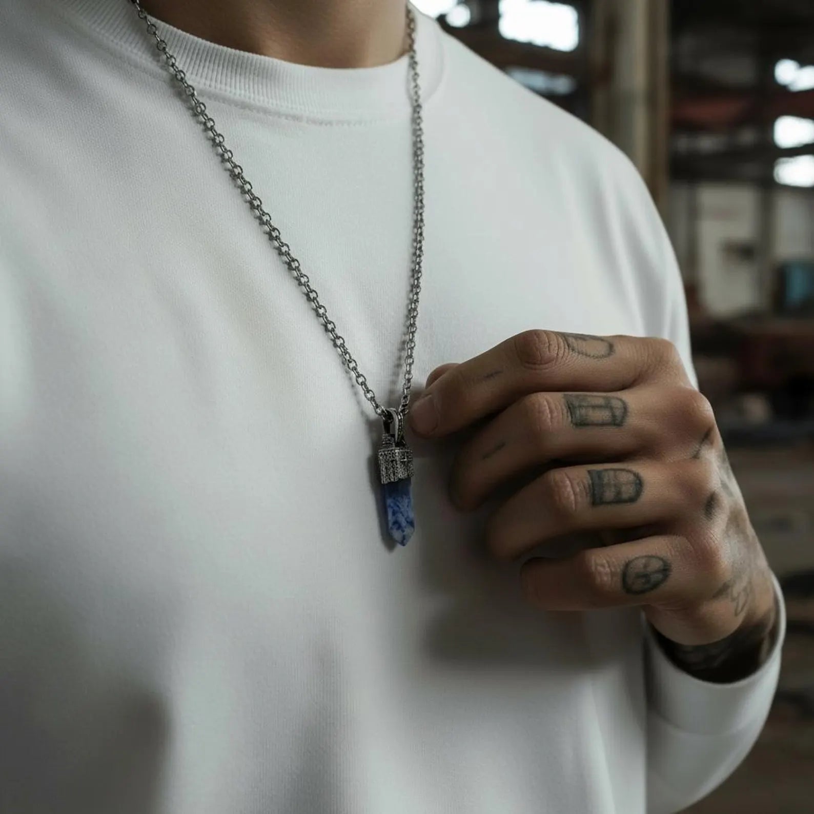 Long vertical pendant necklace featuring a striking blue sodalite crystal encased in a handcrafted sterling silver compass frame, representing spiritual transformation, personal direction, wisdom and serenity — a meaningful, stylish and unique men's jewelry piece.